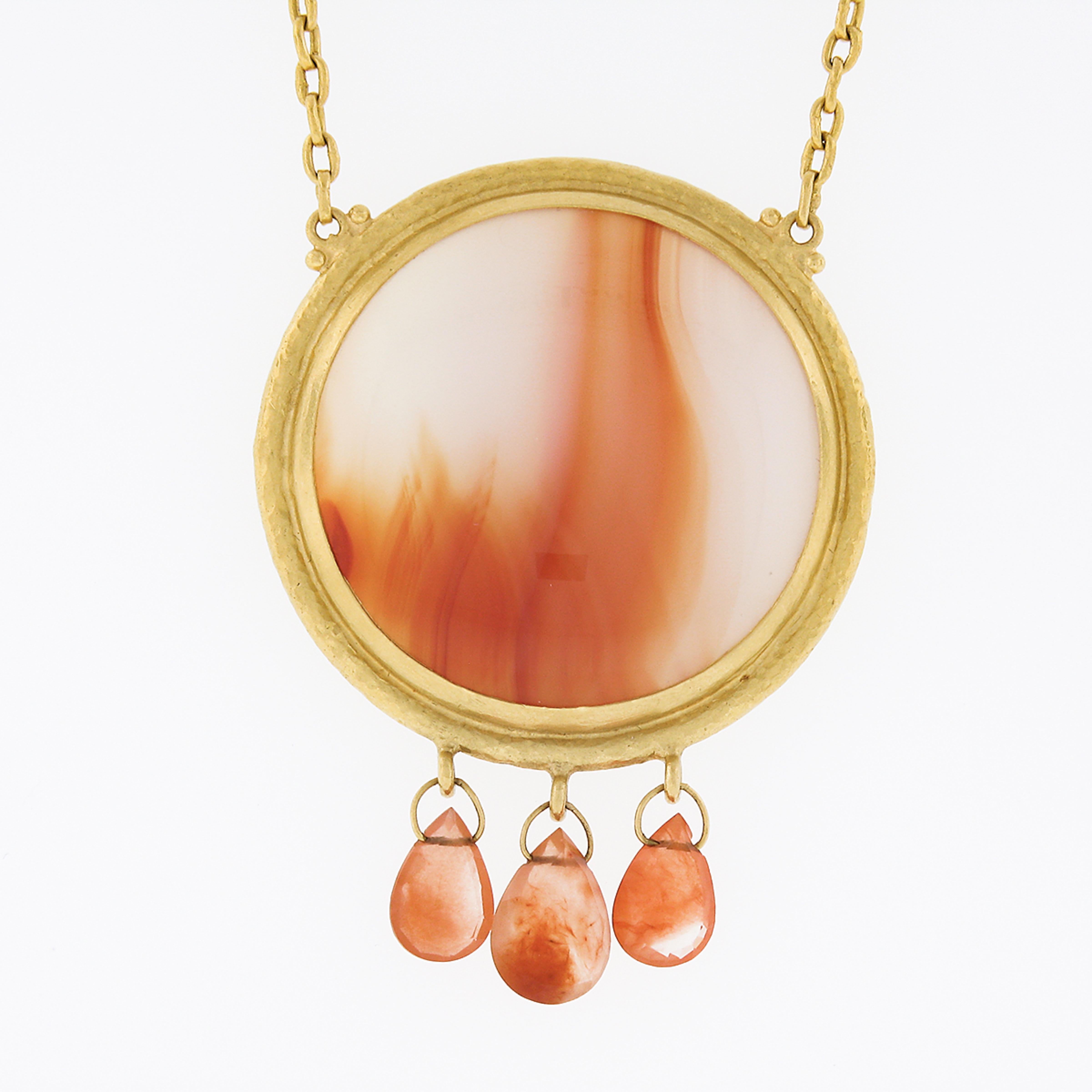 Here we have a magnificent, truly bold, and very well made Gurhan pendant necklace that was crafted in solid 24k yellow gold featuring a large round cabochon cut agate neatly bezel set at the center. This incredible stone measures approximately