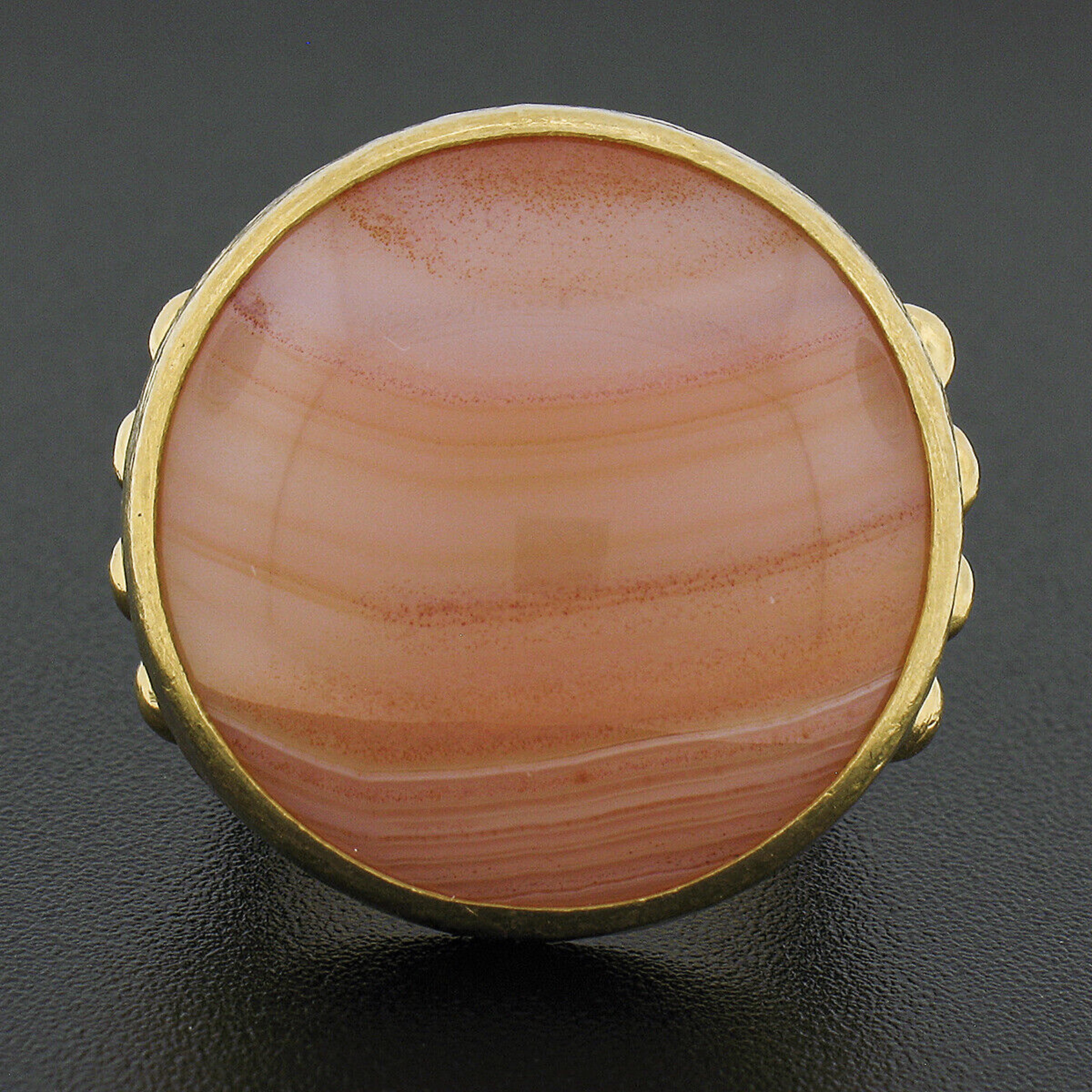 Here we have a magnificent, truly bold, and very well made Gurhan ring that was crafted in solid 24k yellow gold featuring a large round cabochon cut agate neatly bezel set at the center. The solitaire measures approximately 23.3mm in diameter and