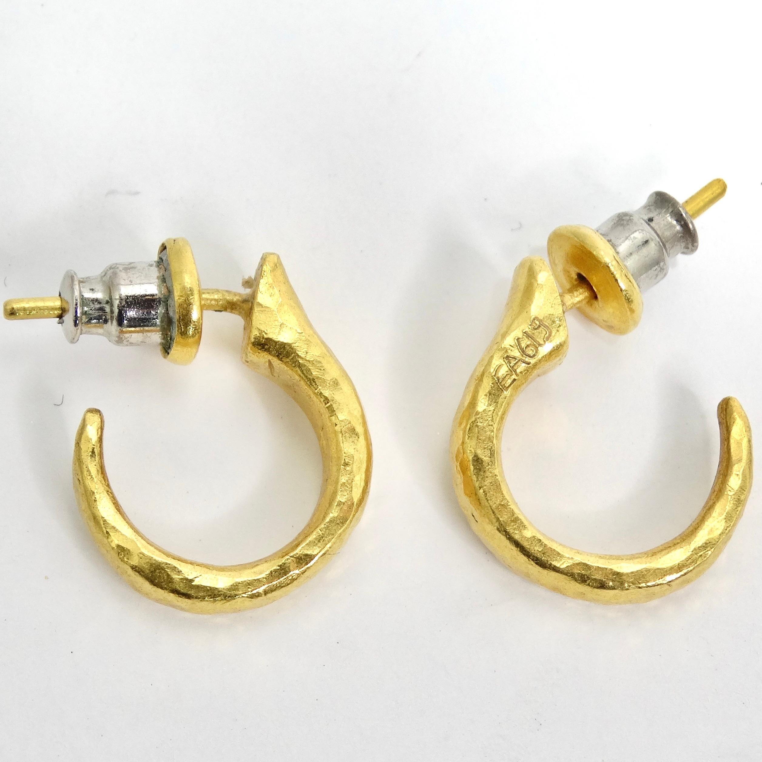 Introducing the Gurhan 24k Gold Thor Hoop Earrings—a classic and timeless pair that effortlessly combines elegance with simplicity. These mini hoop earrings are meticulously crafted, featuring Sterling Silver plated with 24k Gold Vermeil, while the
