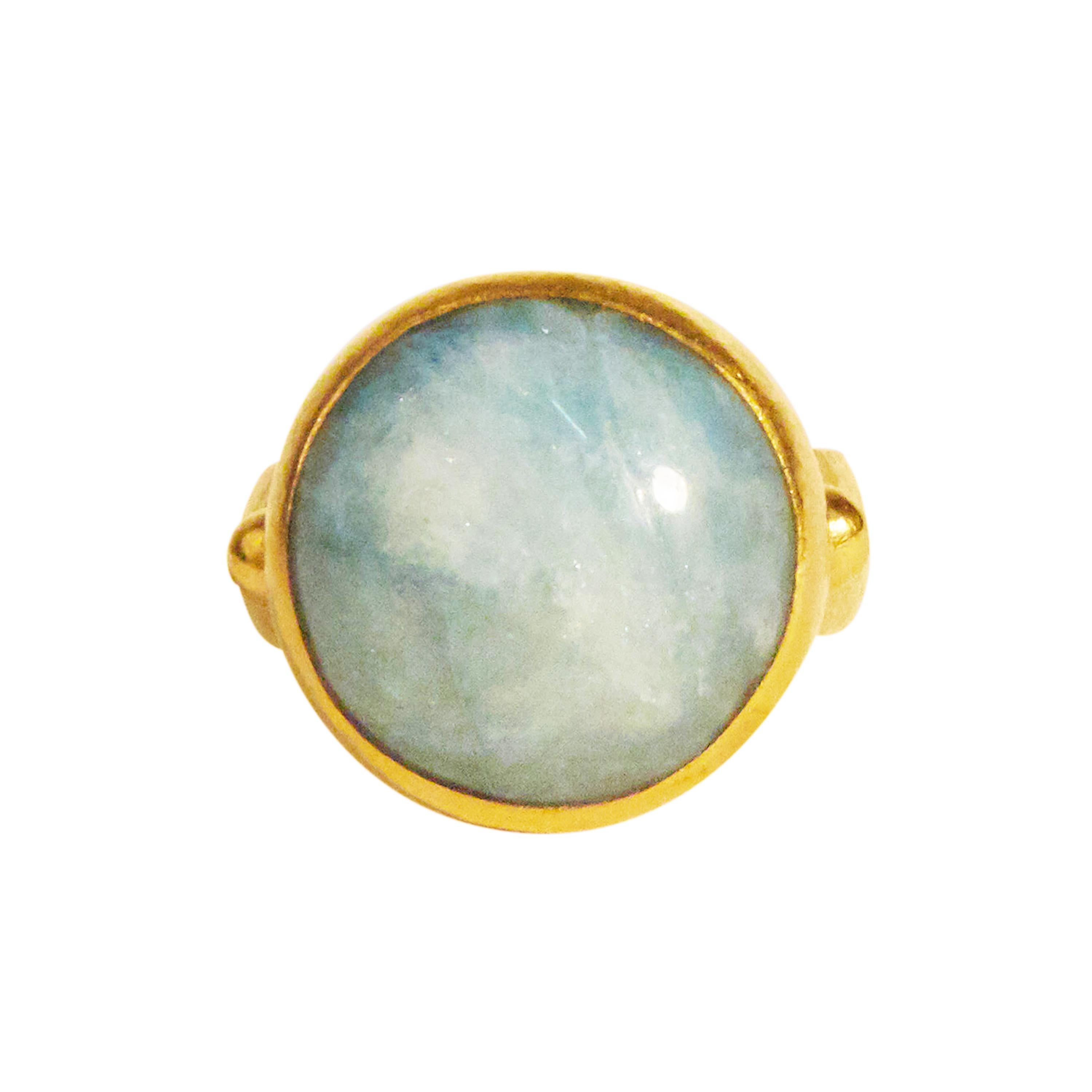 GURHAN one-of-a-kind ring set in 24 Karat hammered yellow gold featuring a 17mm round cabochon Aquamarine, 19.75cts. Bezel stone setting, 22 Karat hammered yellow gold shank with side granulations, size 6.5.