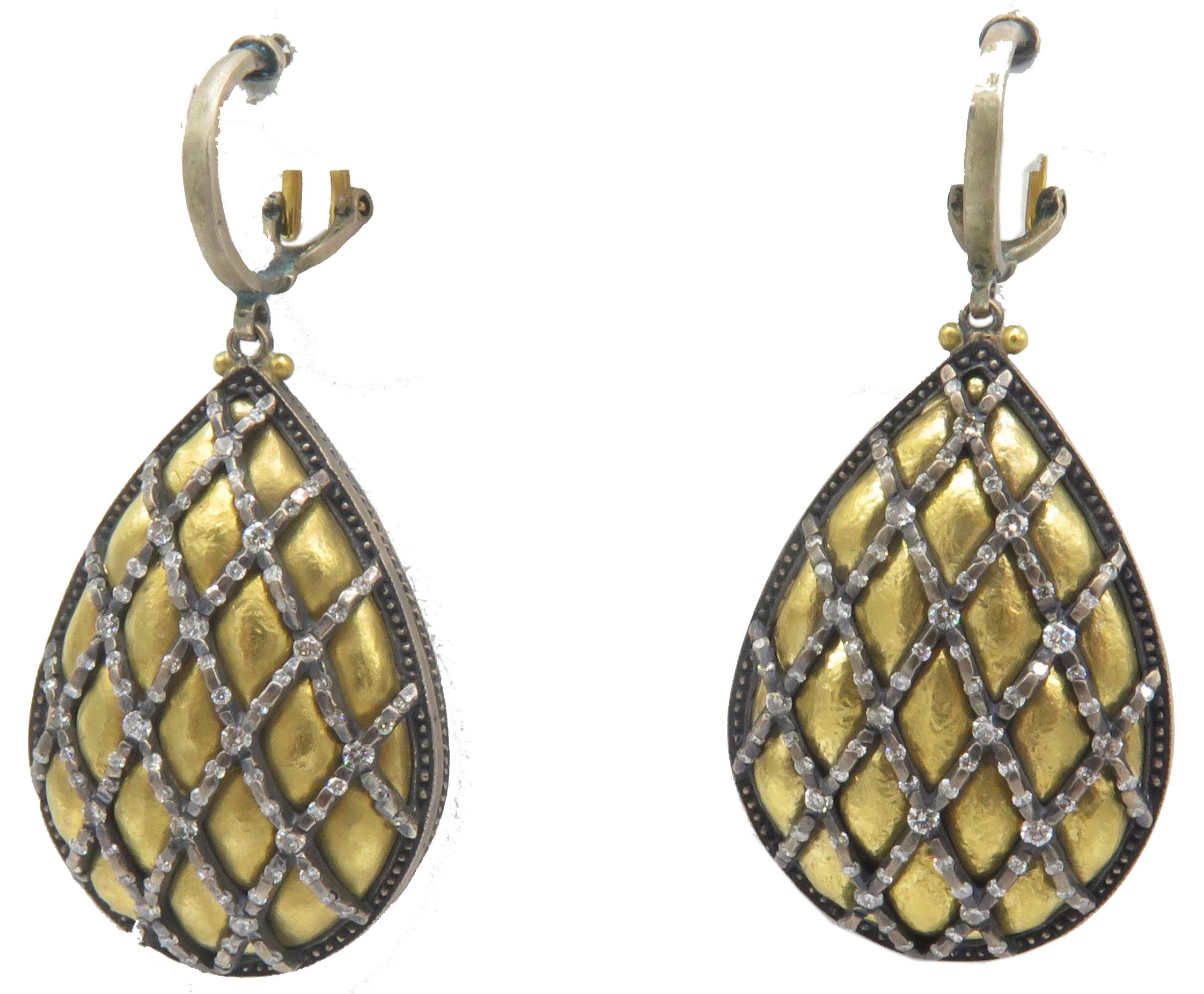 A, lovely pair of dangle lever back earrings by Gurhan. These beautiful earrings are composed of 24k yellow gold and silver. These, beautiful earrings were inspired in a quilted pear shaped motif. They, are extremely gorgeous with beautiful round