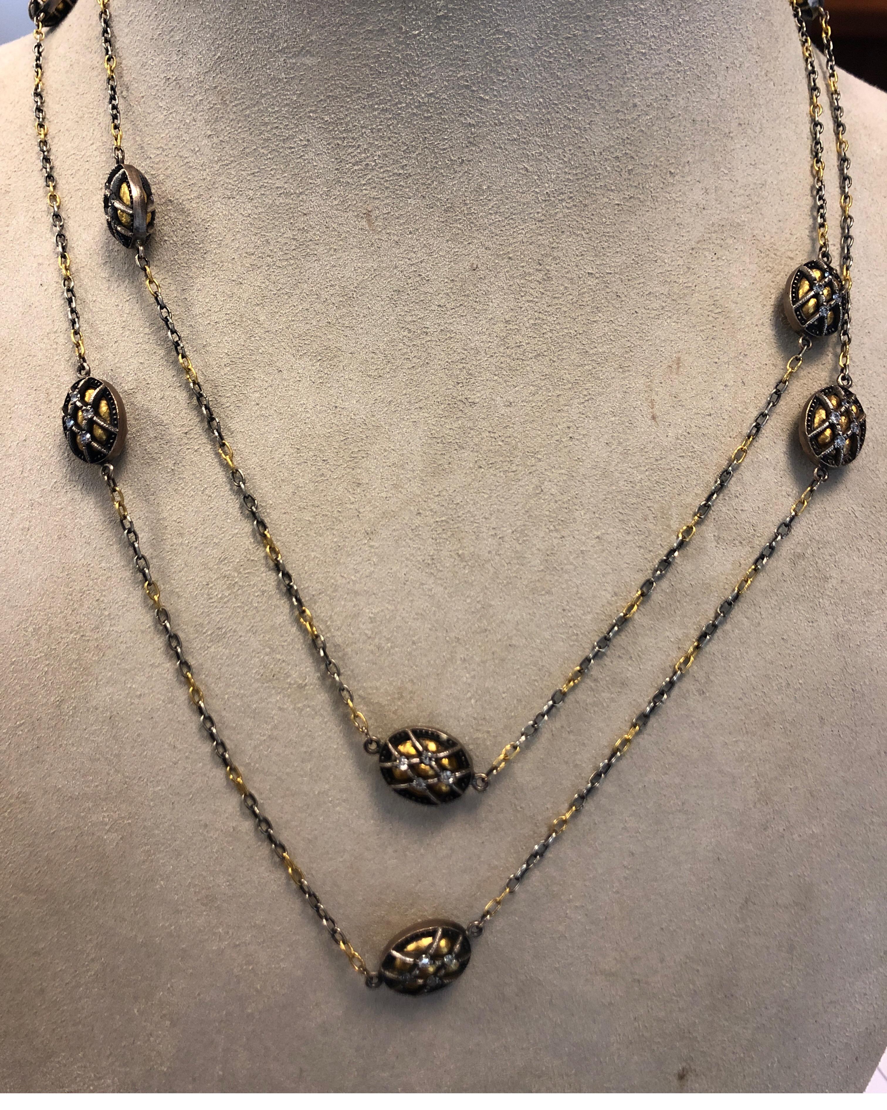 Gurhan 24K yellow gold and silver 42 inch chain necklace, with 11 double sided oval elements each set with 8 round diamonds weighing 1.75cts total. May be worn long or doubled.
Last retail $ 8500










l


