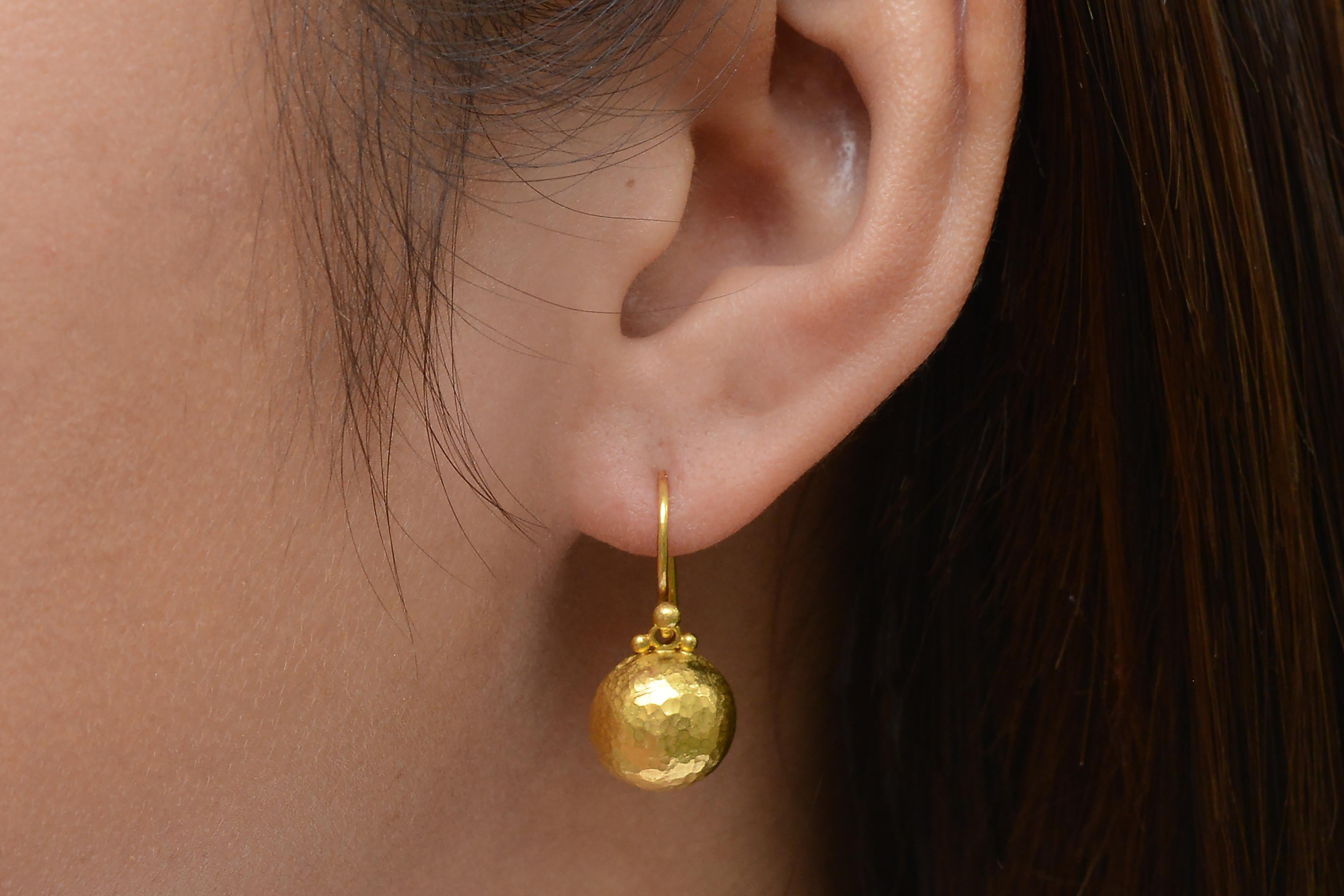 These vintage contemporary 24 karat yellow gold drop earrings by designer Gurhan offer a luxurious accessory at a fine value. With over 99% gold purity the rich, bold color of these earrings are sure to make a lasting statement. You'll love the