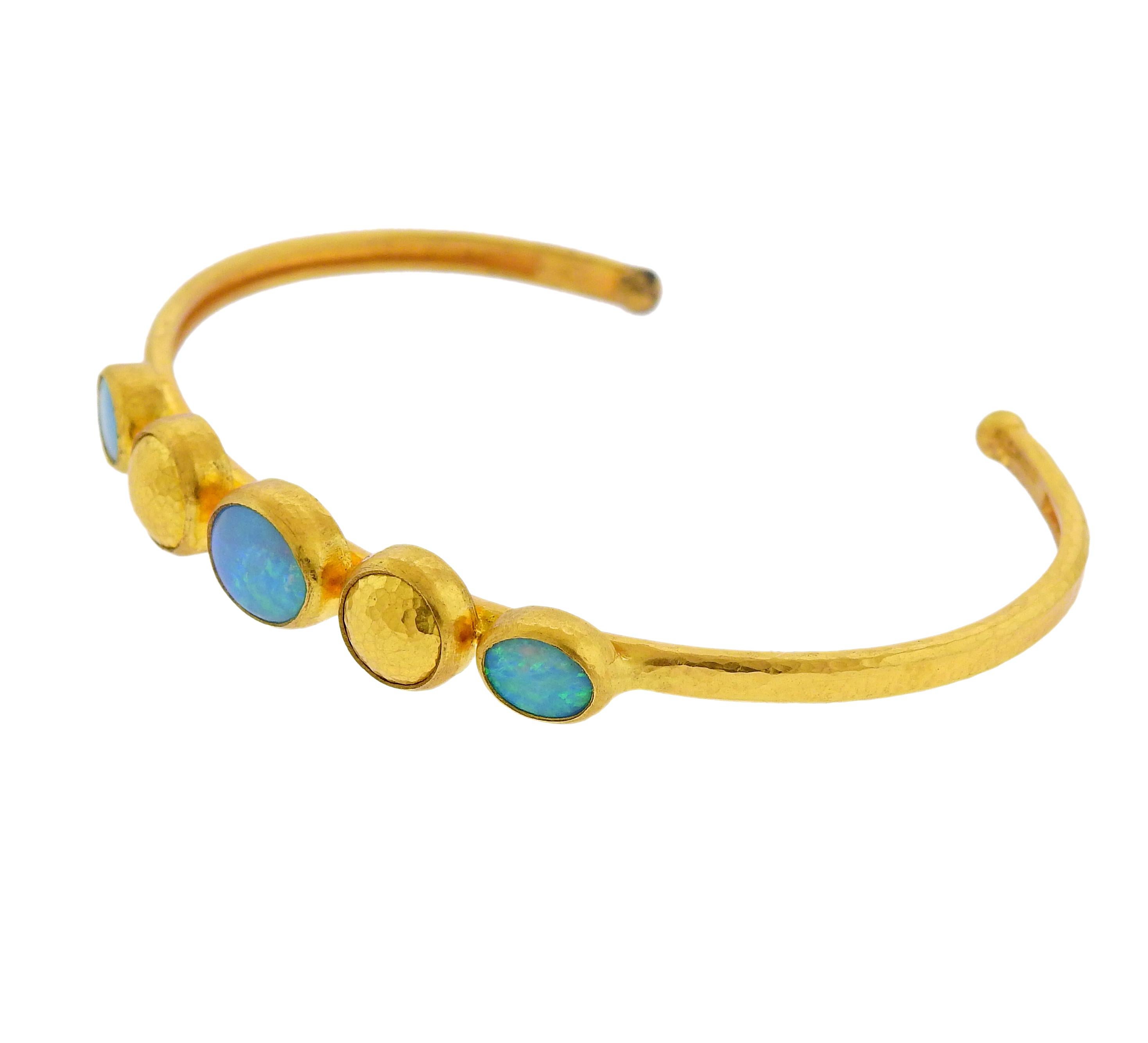 Brand new 22k and 24k gold cuff bracelet by Gurhan, set with opals. Retail $8700. Bracelet will fit approx. 7-7.5