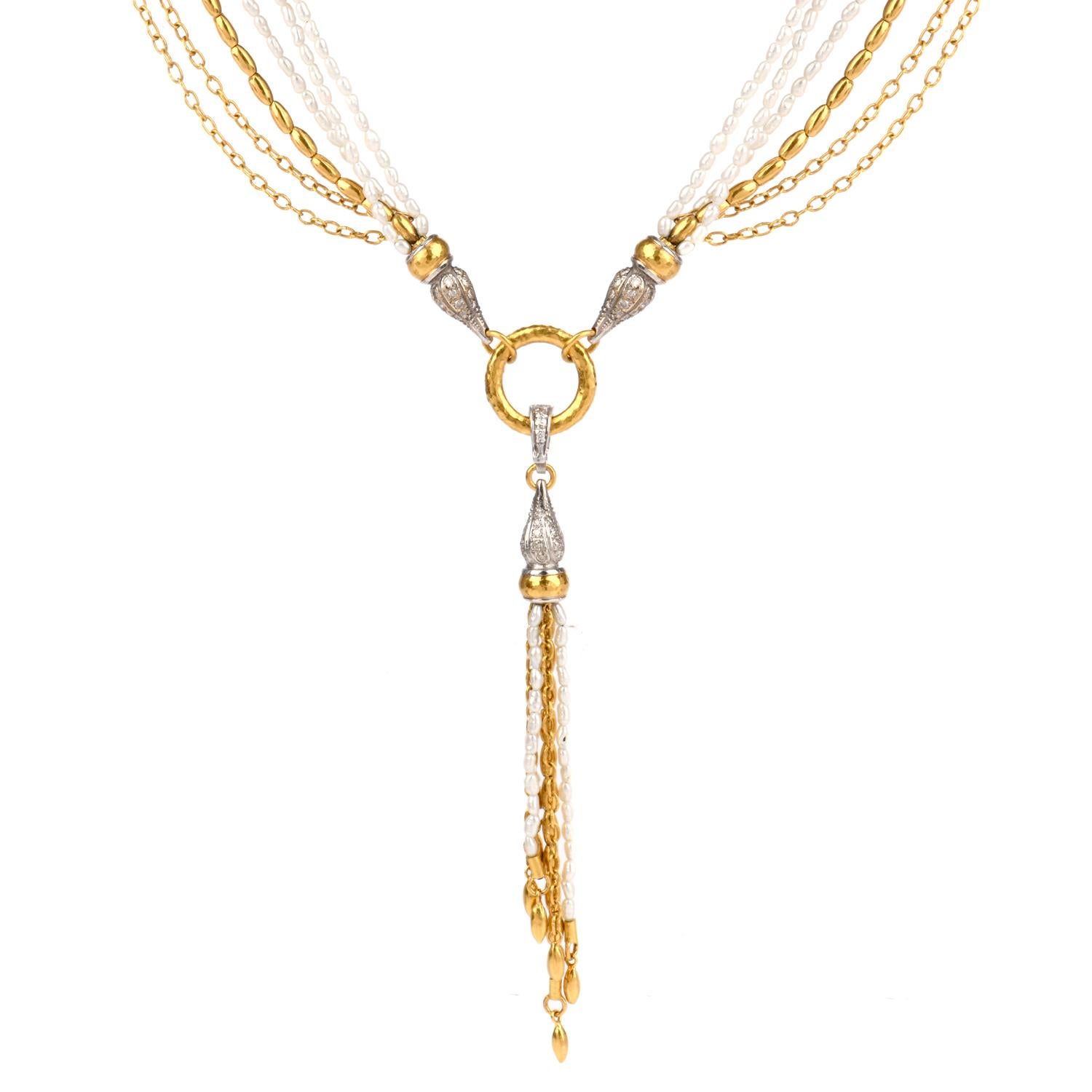 This stylish designer Gurhan multi strand tassel necklace is crafted in 18-karat yellow and white gold, weighing 57.6 grams and measuring 24