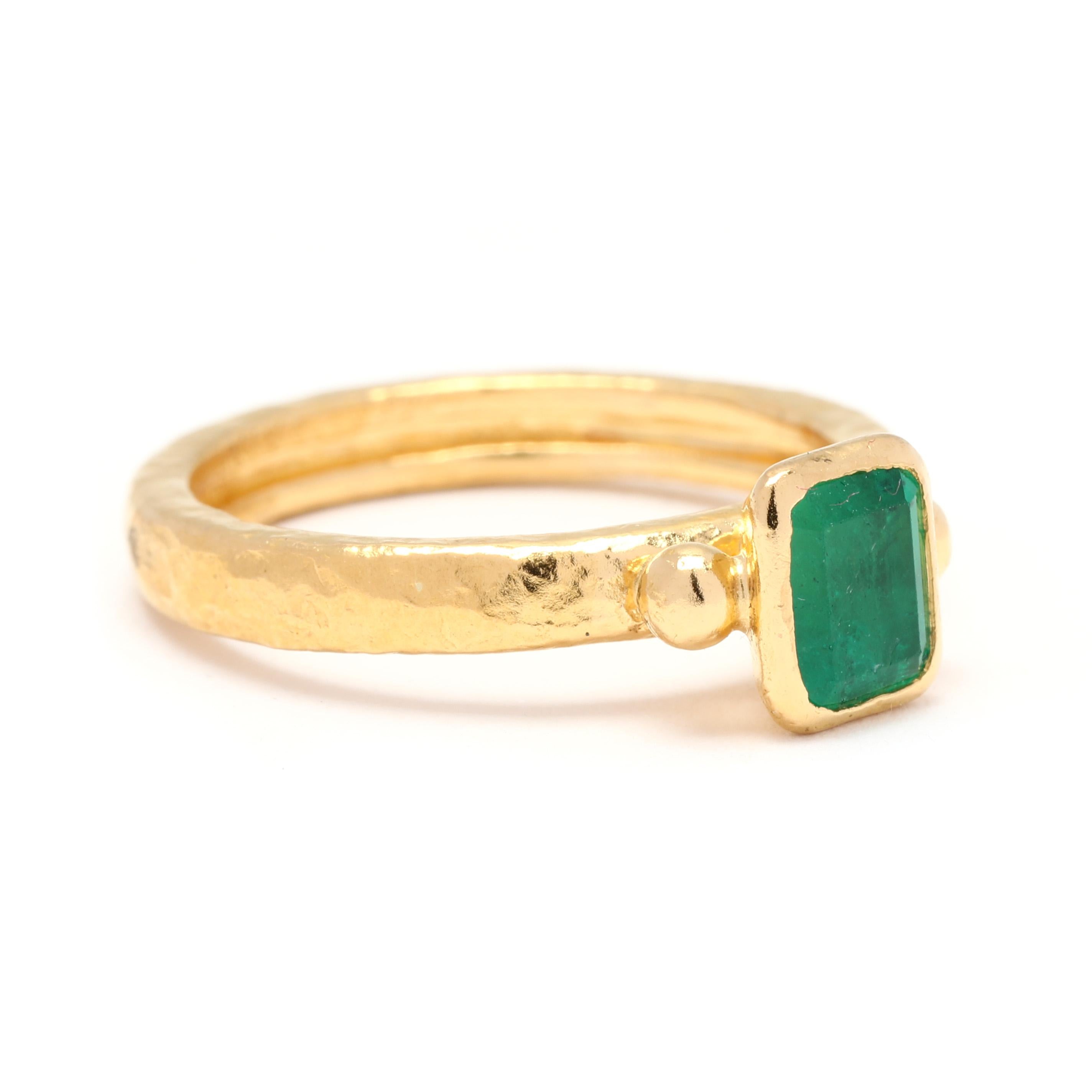 This gorgeous emerald engagement ring by Gurhan is a true masterpiece. Crafted from 24K yellow gold, this ring exudes luxury and elegance. The ring features a stunning emerald stone in a dainty setting, adding a pop of vibrant green color. The
