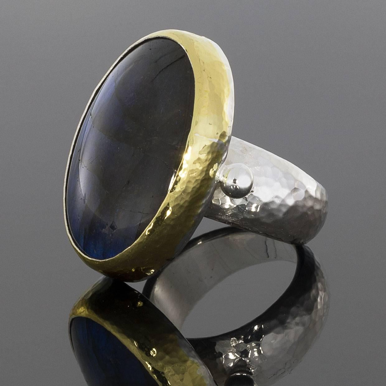 Gurhan is a Turkish designer who was inspired by the look of pure gold to create his own collection. This ring is from the Galapagos collection, which features bezel set colored gemstones. This captivating labradorite ring would be a great addition