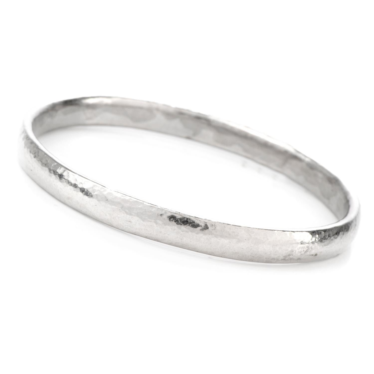 This Designer Gurhan bangle bracelet was finished with a hand applied hammered

finish and crafted in Luxurious Platinum.

This classic design is easily stacked allowing a different 

look each time it's worn.

Measuring appx. 7.1mm x 7.5