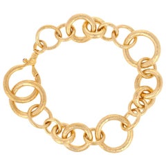 Bracelet Gurhan Hoopla:: or jaune 24 carats:: maillons ronds de tailles diverses:: accentués de rubis