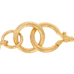 Bracelet Gurhan Hoopla:: or jaune 24 carats:: maillons ronds de tailles diverses:: accentués de rubis