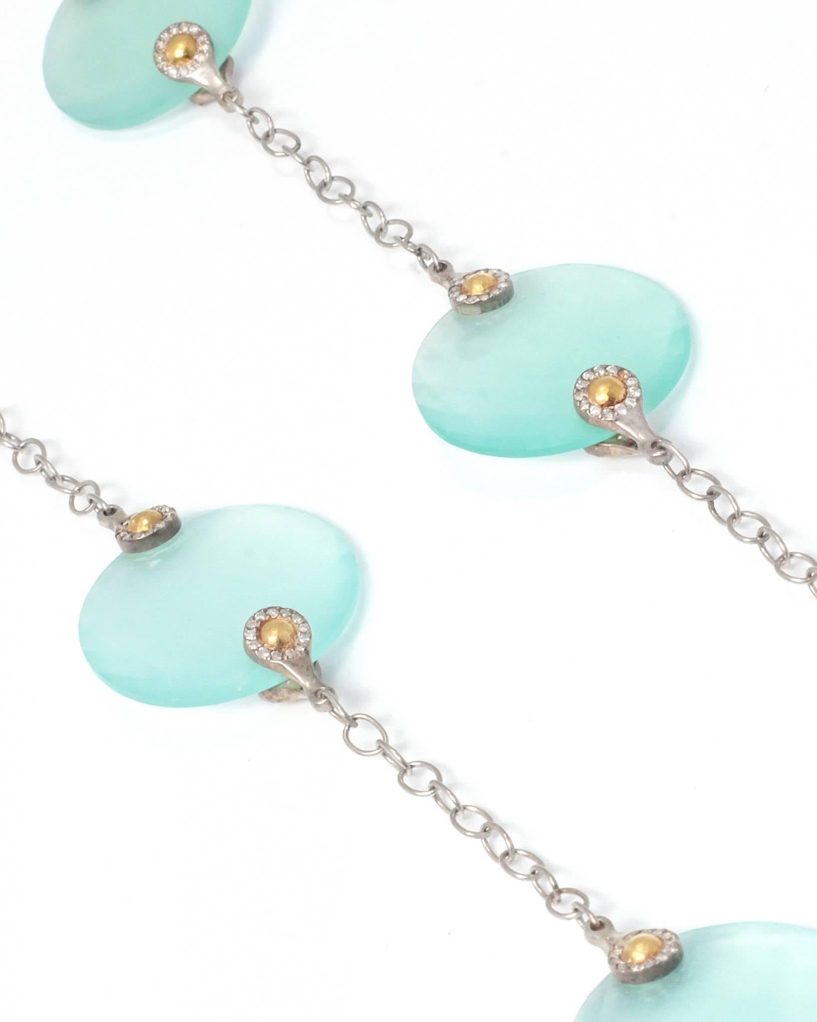 Elevate your Bohemian style with this rare Nokta Discus Station Necklace by GURHAN. This unique design is ornately crafted in Sterling Silver and layered with exquisite 24K Gold. The eight 25mm round, double-sided, rose-cut Aqua Chalcedony Stones