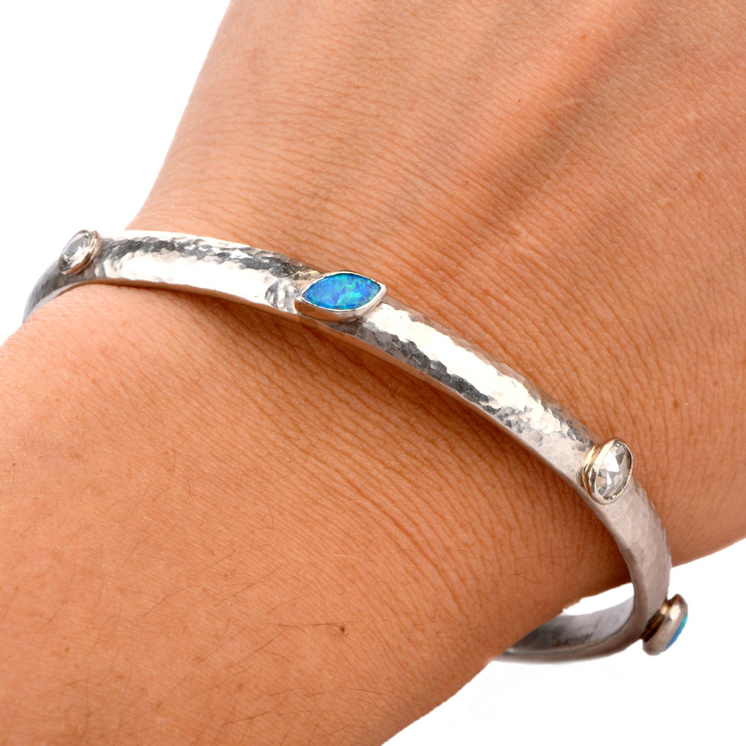 Add this Stackable Hand hammered  solid platinum Bangle bracelet to your collection.

Featuring a variety os shapes in both Rose cut Diamonds

and Opals create the highlights of this bracelet.

4 Opal stones weigh appx. 2.16 carats.

Diamonds
