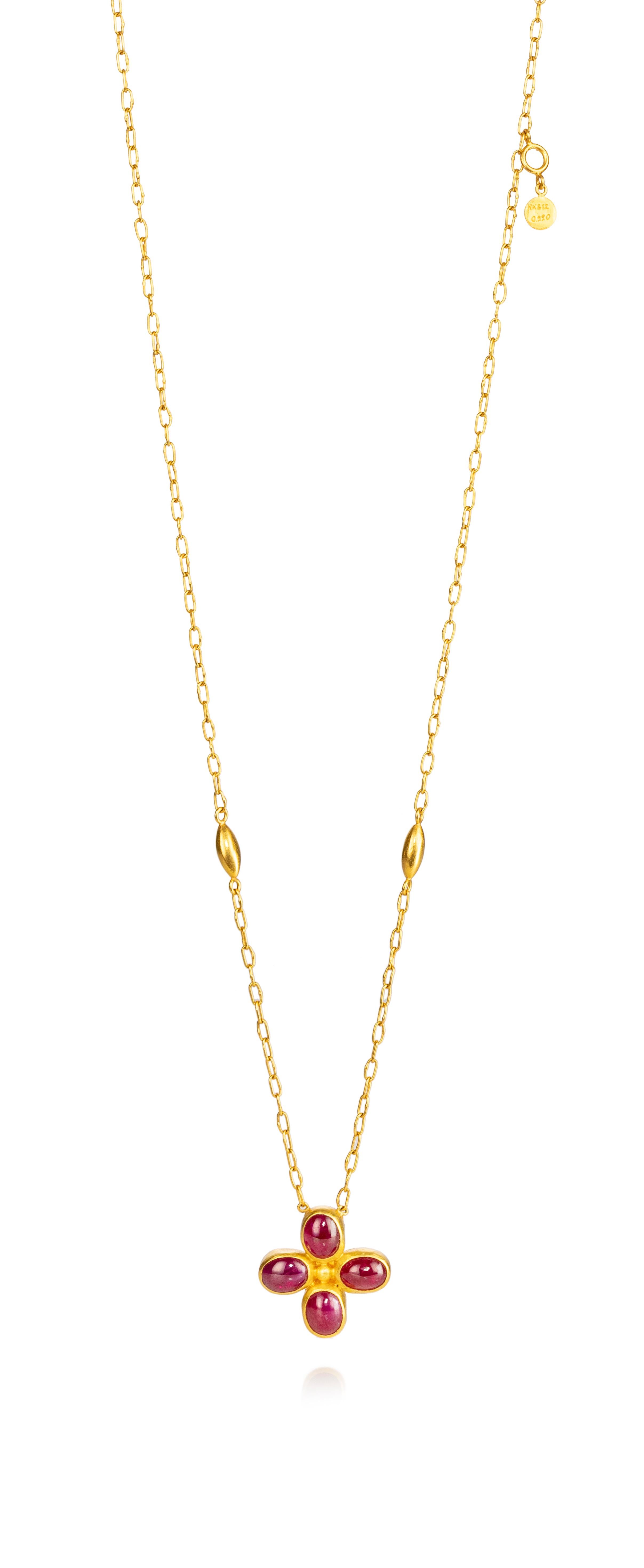 Authentic one-of-a-kind hand crafted Gurhan pendant.  
Featuring  large 4 large oval cabachon ruby's.  
Gold chain is 18