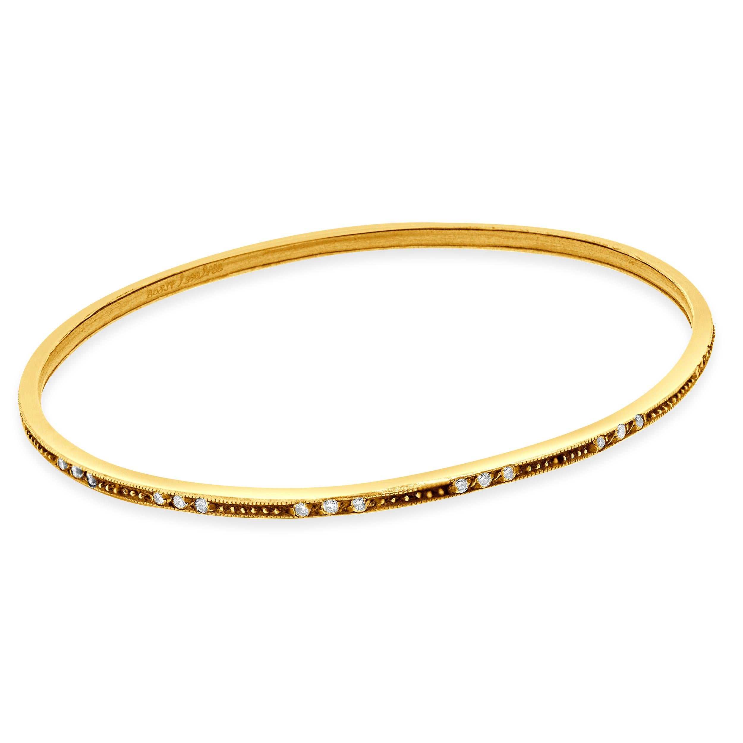 Designer: Gurhan
Material: sterling silver and 24k yellow gold
Diamond: 42 round cut = 0.65cttw
Color: I
Clarity: SI2
Serial: B0837/990/166
Dimensions: bracelet will fit approximately up to an 8-inch wrist
Weight: 8.84 grams
