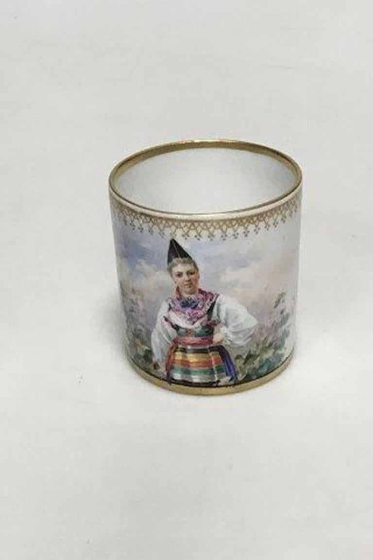 Gustafsberg. Nice hand painted porcelain cup and saucer, with women in traditional folk costumes. Both Marked Gustafsberg 1895.

Measures: Height (Cup): 6 cm (2 23/64