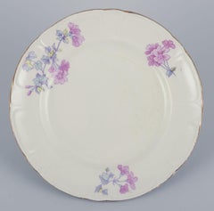 Gustafsberg, Sweden. A set of six flat earthenware ‘Geranium’ plates.