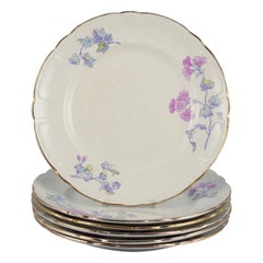Gustafsberg, Sweden. A set of six flat earthenware ‘Geranium’ plates.