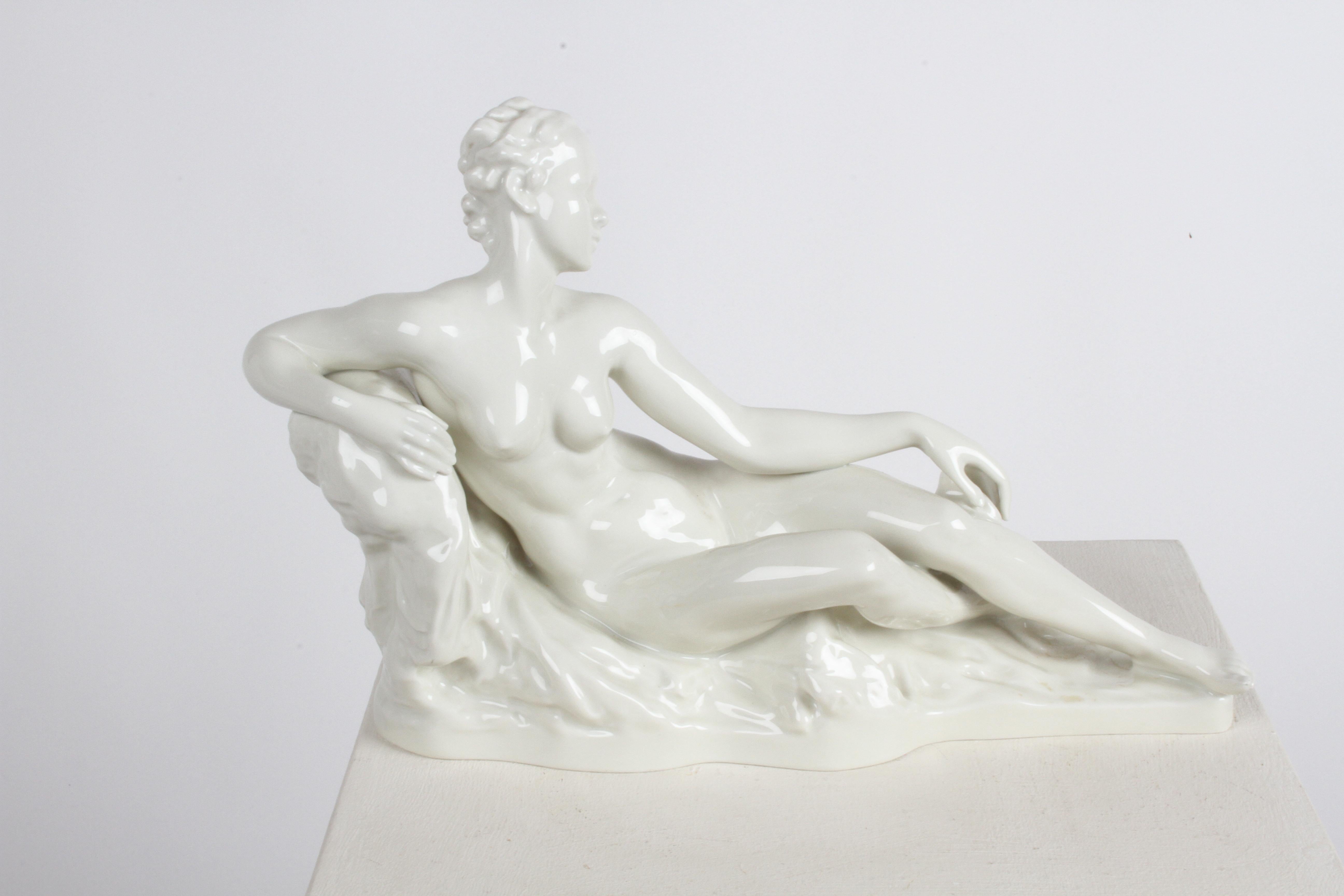 Large Rosenthal Germany porcelain c. 1934 reclining Art Deco nude figure by Gustav Adolph Bredow (1875-1950). Marked with green Rosenthal Germany, Kunstabteilung SELB to the bottom. Signed Bredow to the side pedestal. In fine condition, no damage