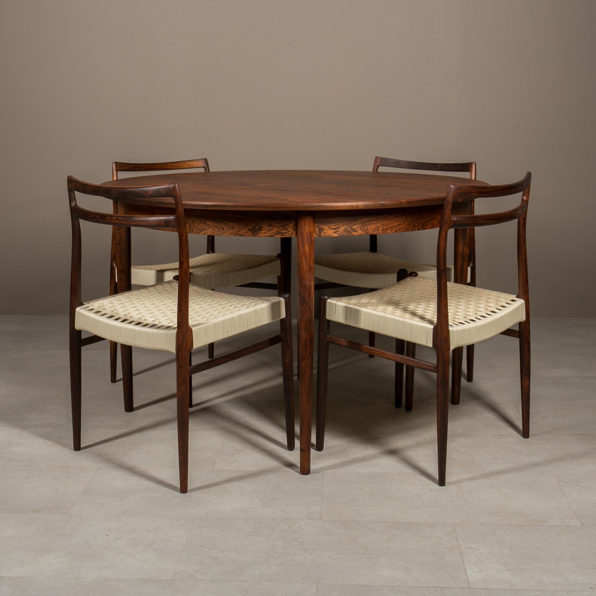 This gorgeous dining set was designed by Alf Aarseth for Gustav Bahus around 1960s. The set features an extendable round table (Model no. R8) and four dining chairs (Model no. 146). Table is easily extendable with 50cm additional leaf, which means