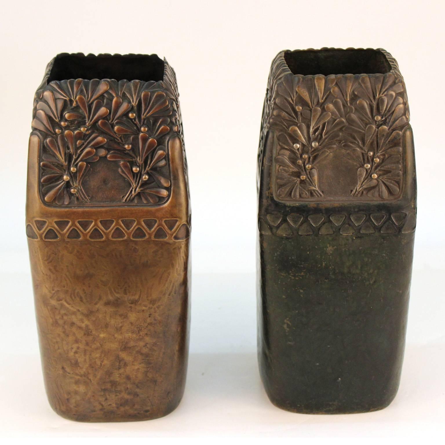 A pair of decorative vases in patinated bronze, made by celebrated Austrian sculptor and founding member of the Vienna Secession Gustav Gurschner (1873-1970). Marked 'Made in Austria, WKE [Wiener Kunst-Erzgiesserei] 504/111' on bottom, with One vase