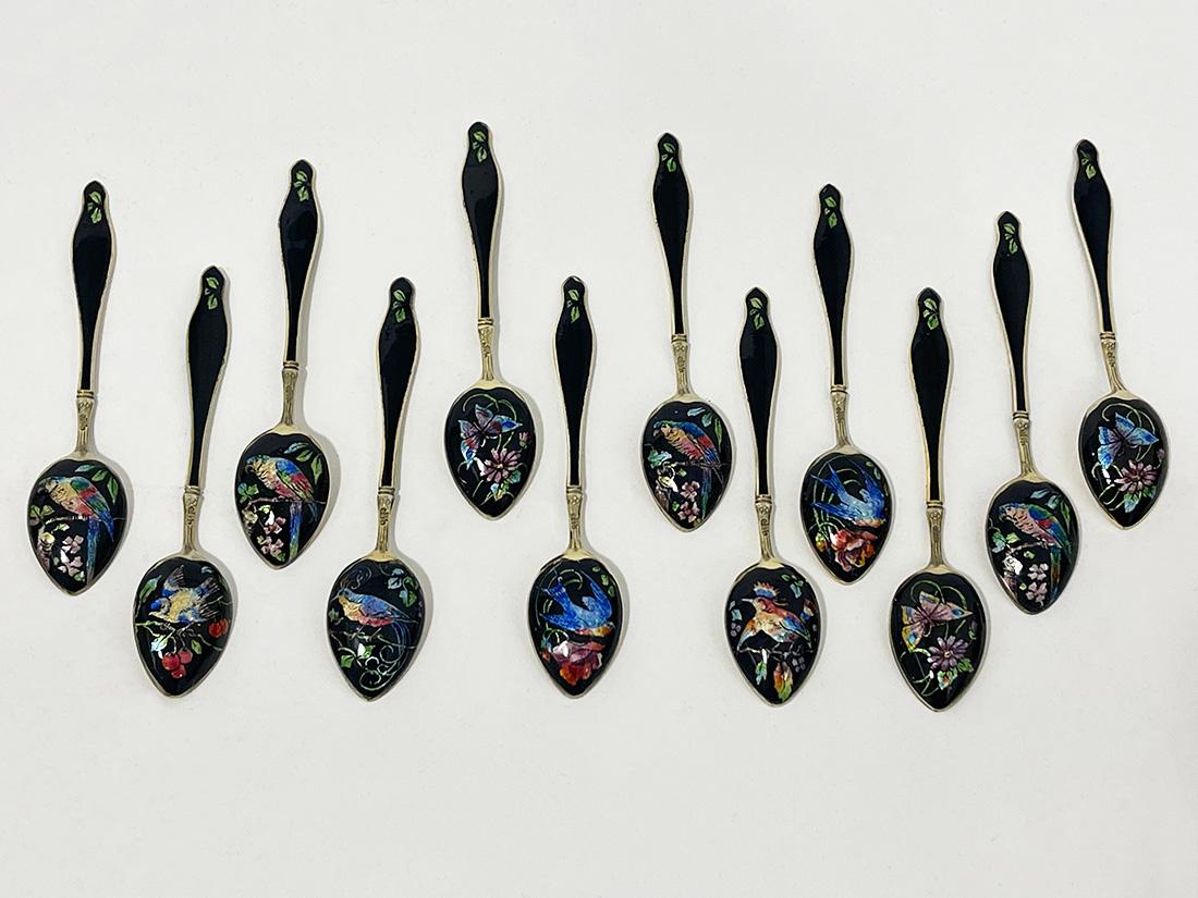 Gustav Hellstrøm enamel and gilt silver teaspoons, Norway, ca 1890

Beautiful set of teaspoons, silver purity of 925/000 gilded with enamel. The spoon handle is black enameled with green enamel leaf motif on the front and back. on the back of the