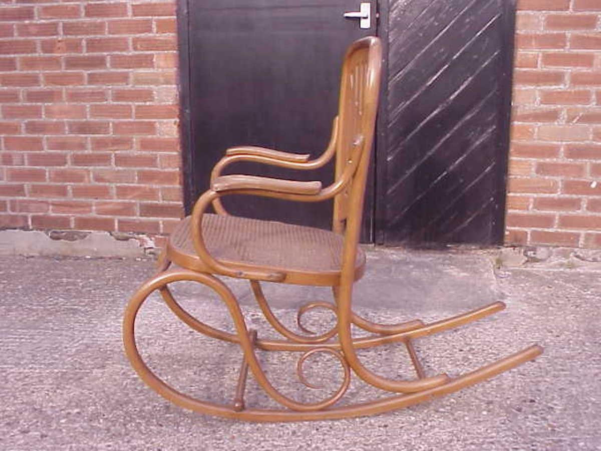 Gustav Siegel attributed, made by Thonet. A bentwood and cane rocking chair.