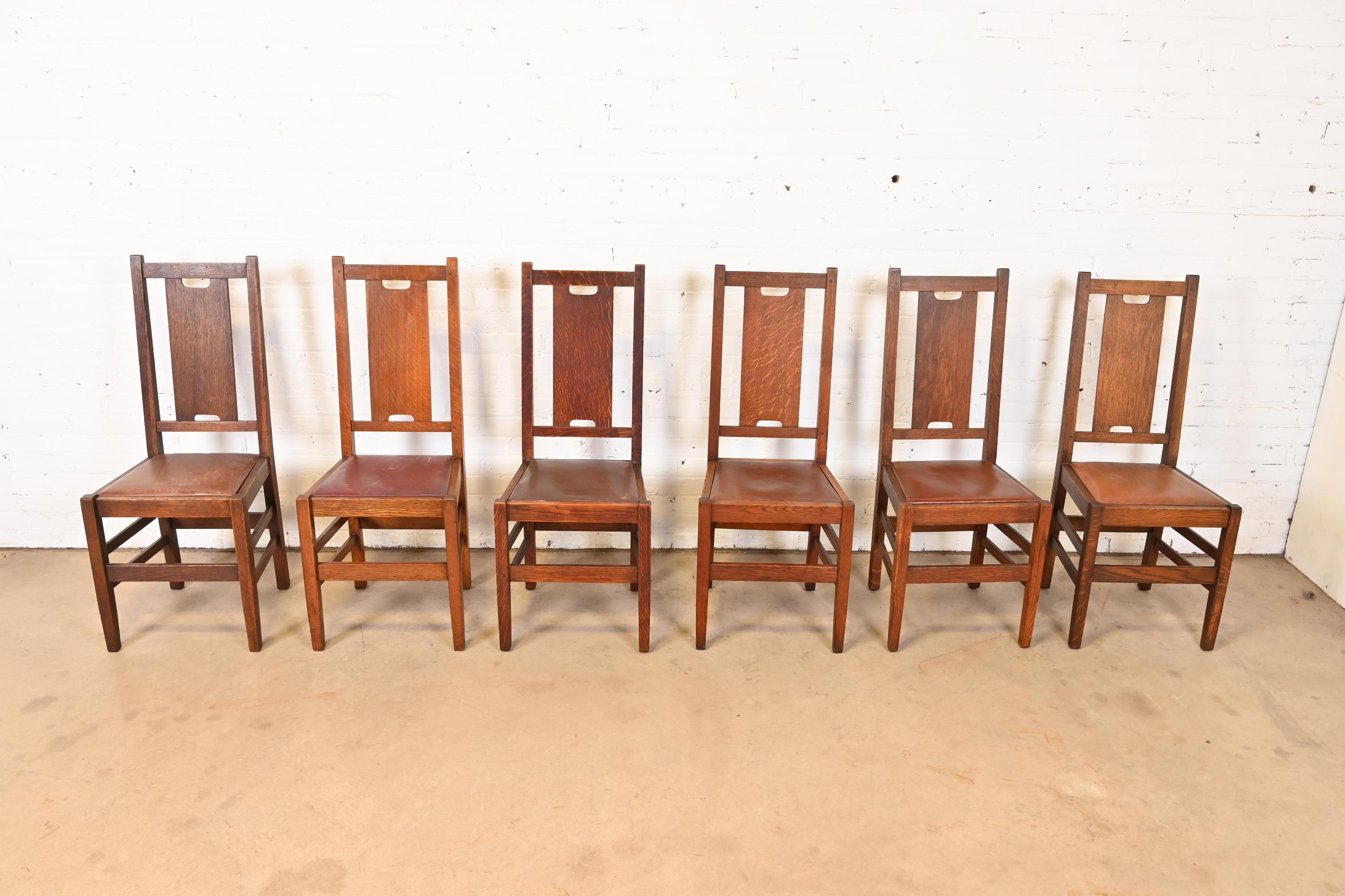 A gorgeous set of six Mission or Arts & Crafts H-back dining chairs

By Gustav Stickley (two chairs with original paper labels)

USA, Circa 1900

Solid quarter sawn oak, with leather seats.

Measures: 16.75