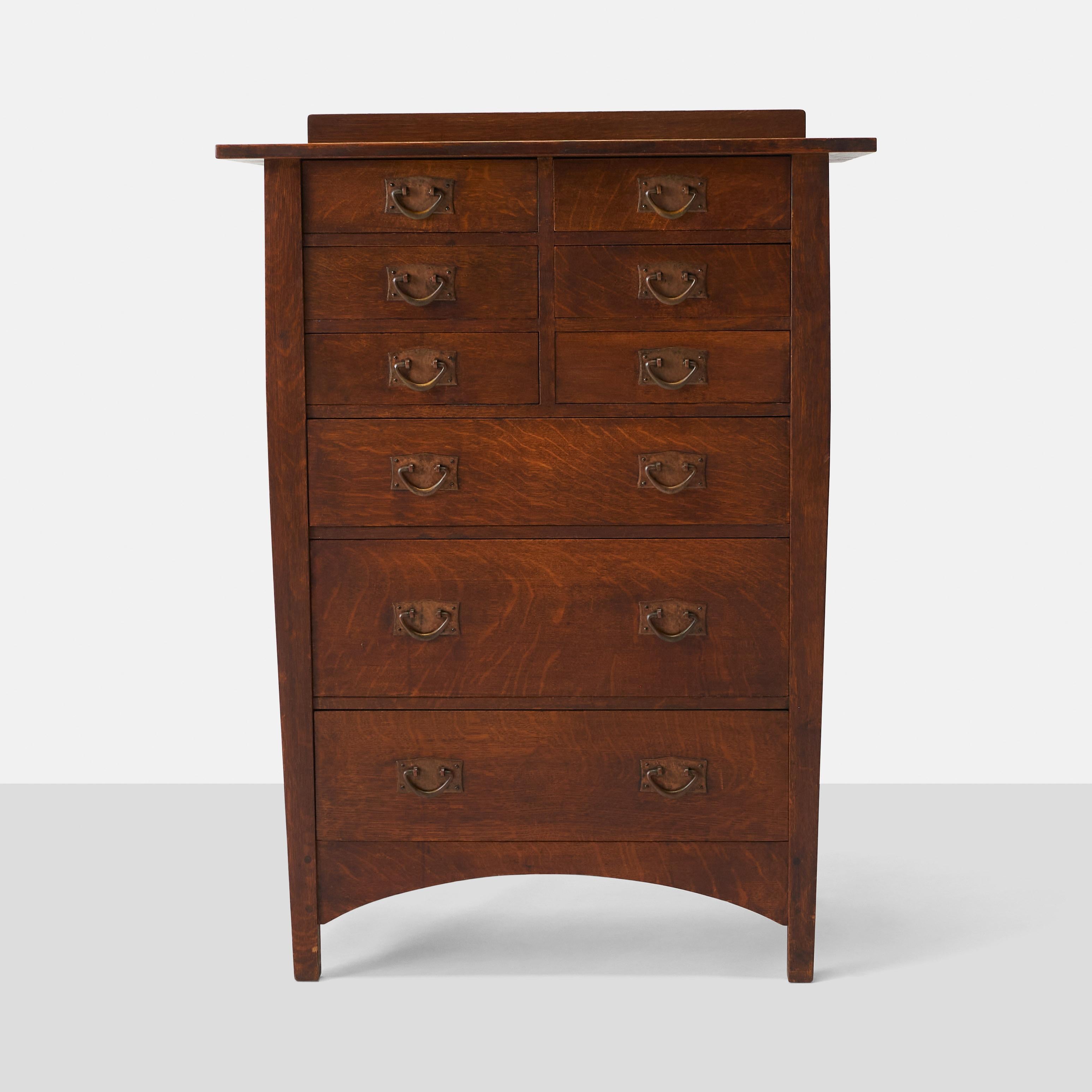 A nine drawer oak dresser with iron pulls.