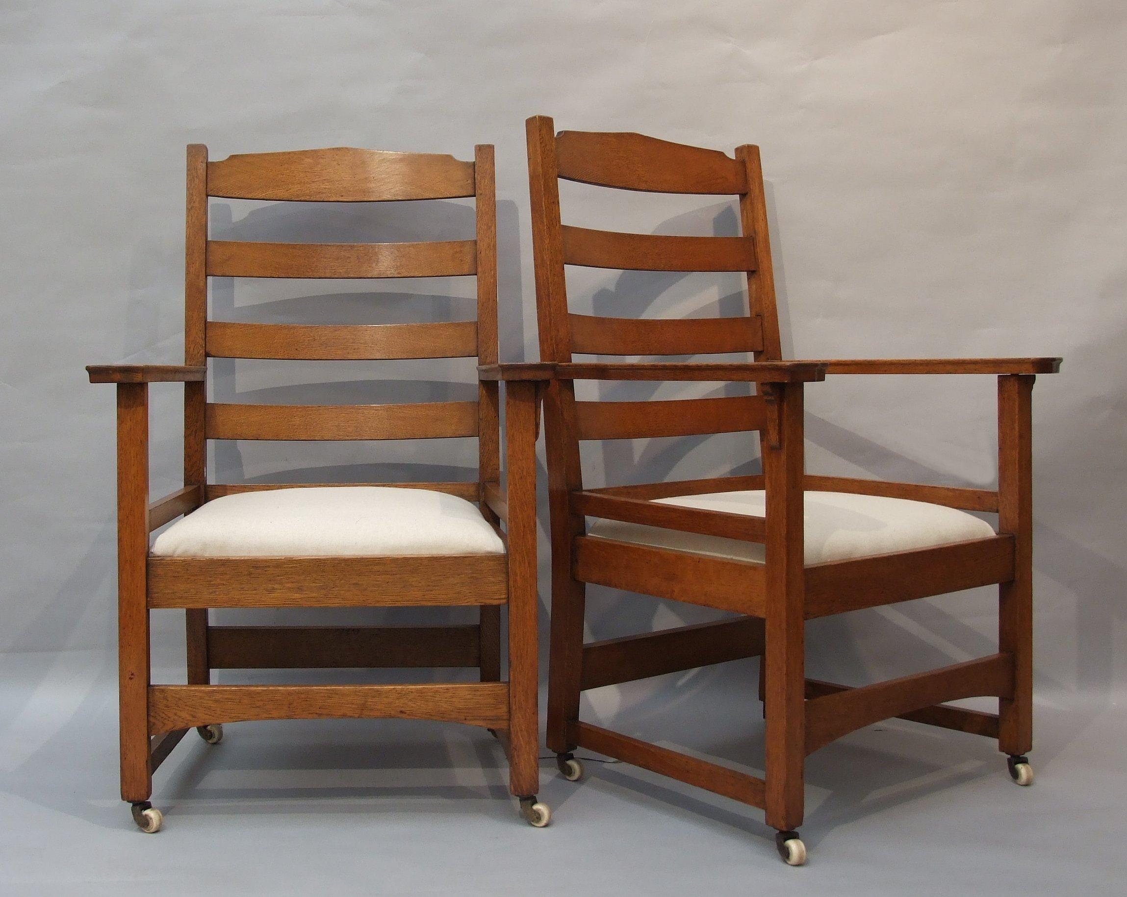 Gustav Stickley a rare set of eight oak American Arts & Crafts ladder-back dining chairs, design no. 965, six sides, two arms, with drop-in seats newly re-upholstered in 100% linen, on period porcelain castors to the legs, designed in 1902, made by