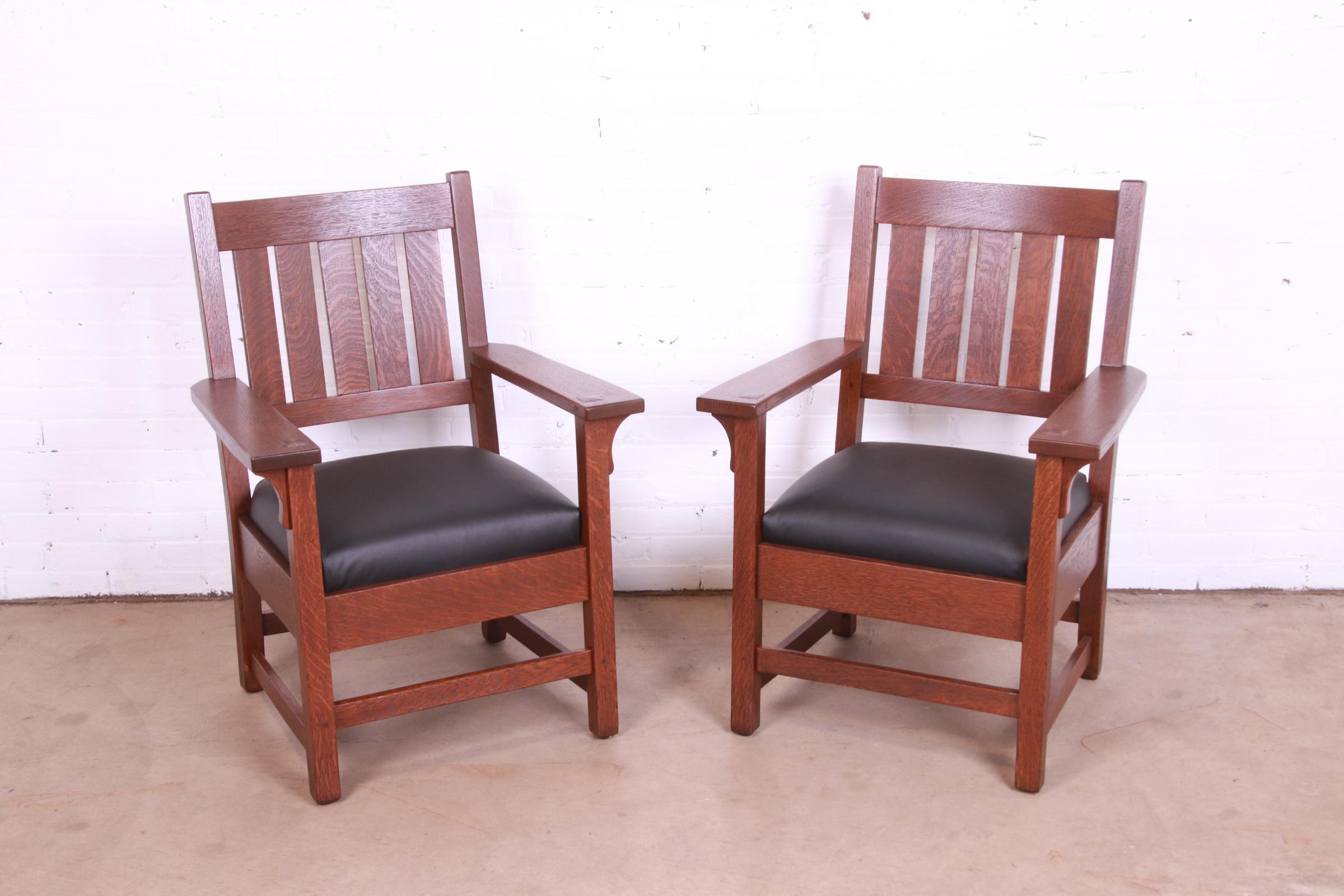 An exceptional pair of Mission Arts & Crafts lounge chairs or club chairs

By Gustav Stickley

USA, Circa 1909

Solid quarter sawn oak frames, with black leather seats.

Measures: 27.13
