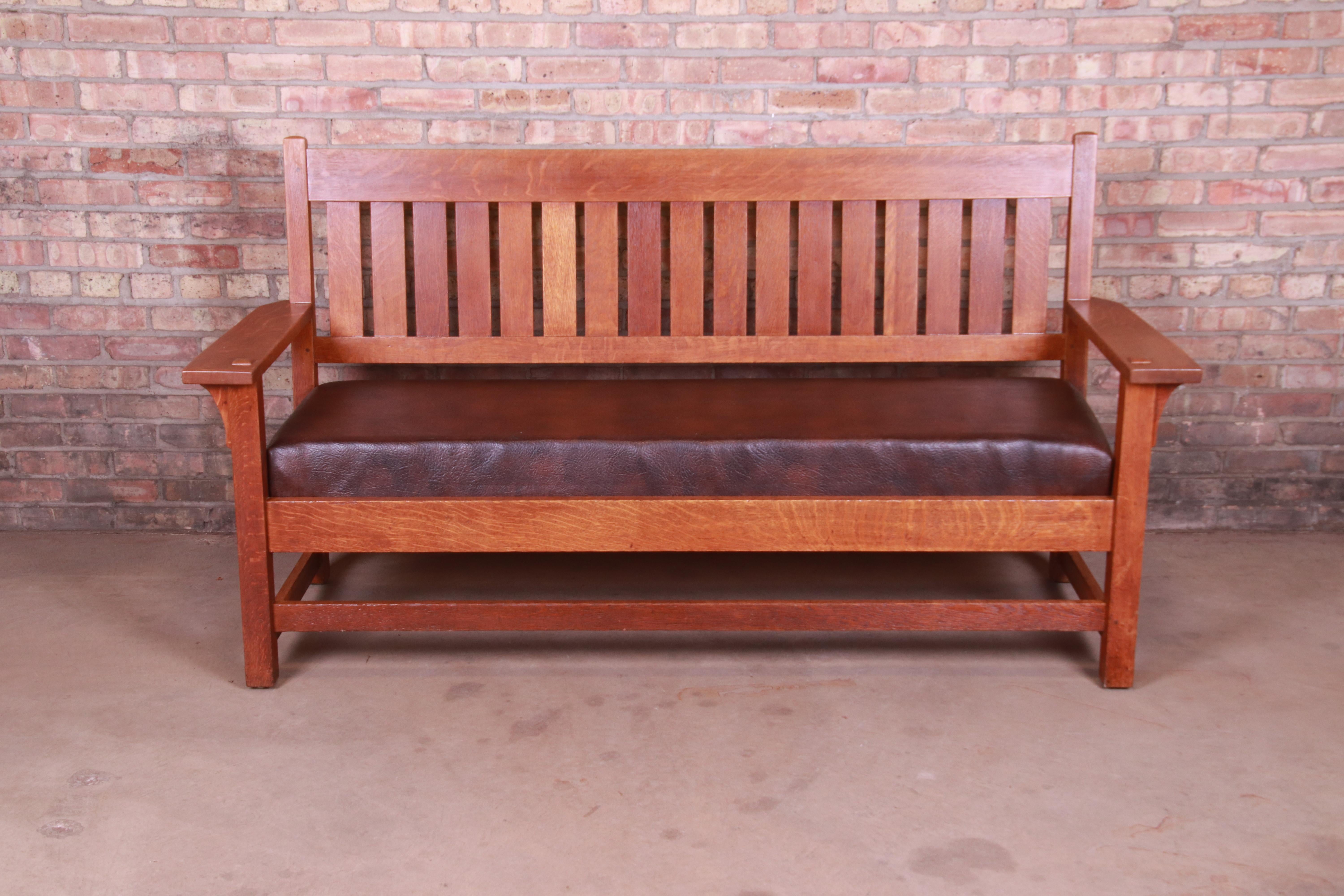 A rare and exceptional Mission Arts & Crafts settle sofa or bench

By Gustav Stickley (original branded label)

Eastwood, NY, circa 1900

Quartersawn oak, with upholstered seat.

Measures: 71.75