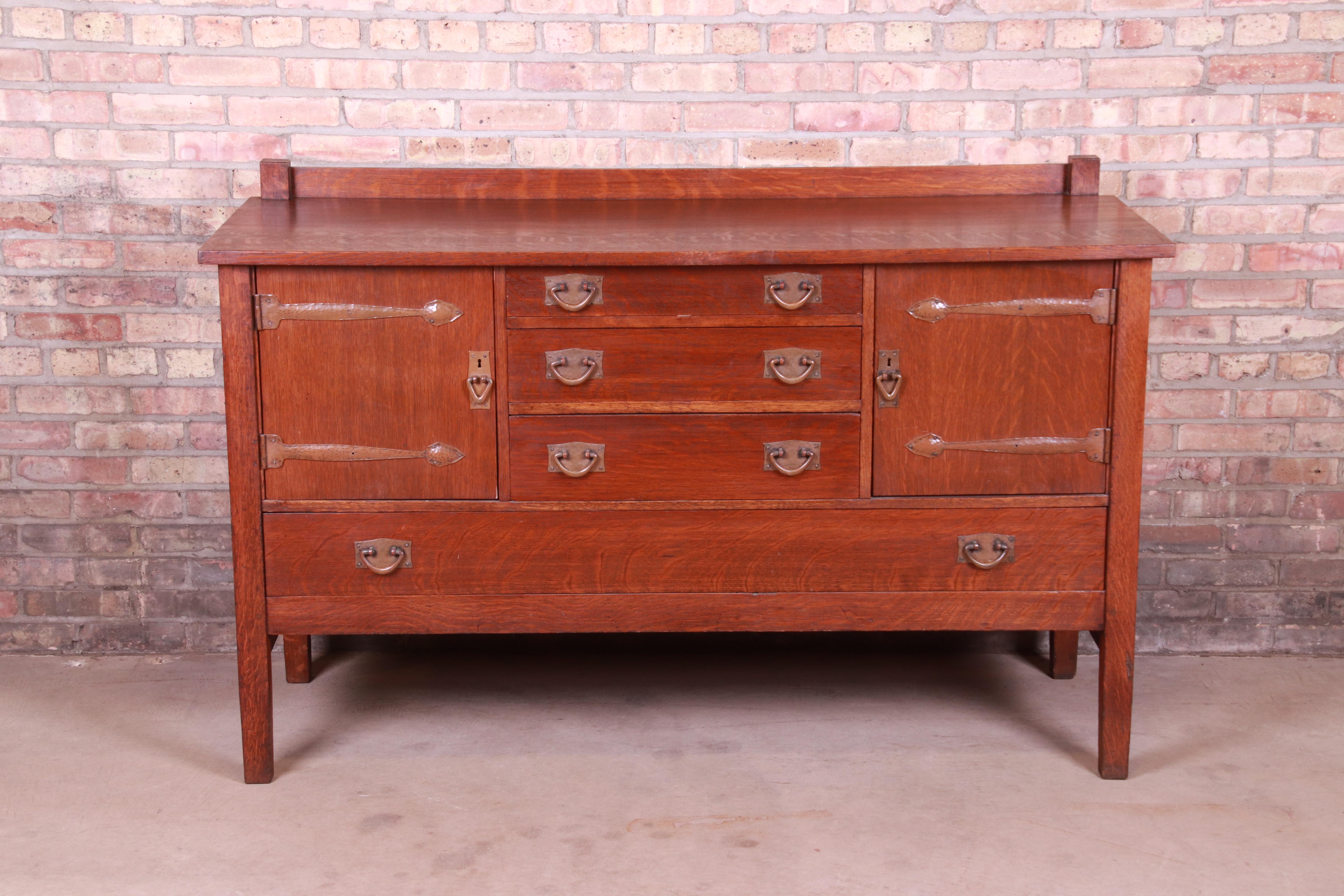 A rare and exceptional antique Mission oak Arts & Crafts sideboard or credenza

By Gustav Stickley

USA, Circa 1900

Quarter sawn oak, with original hammered copper hardware.

Measures: 62.25
