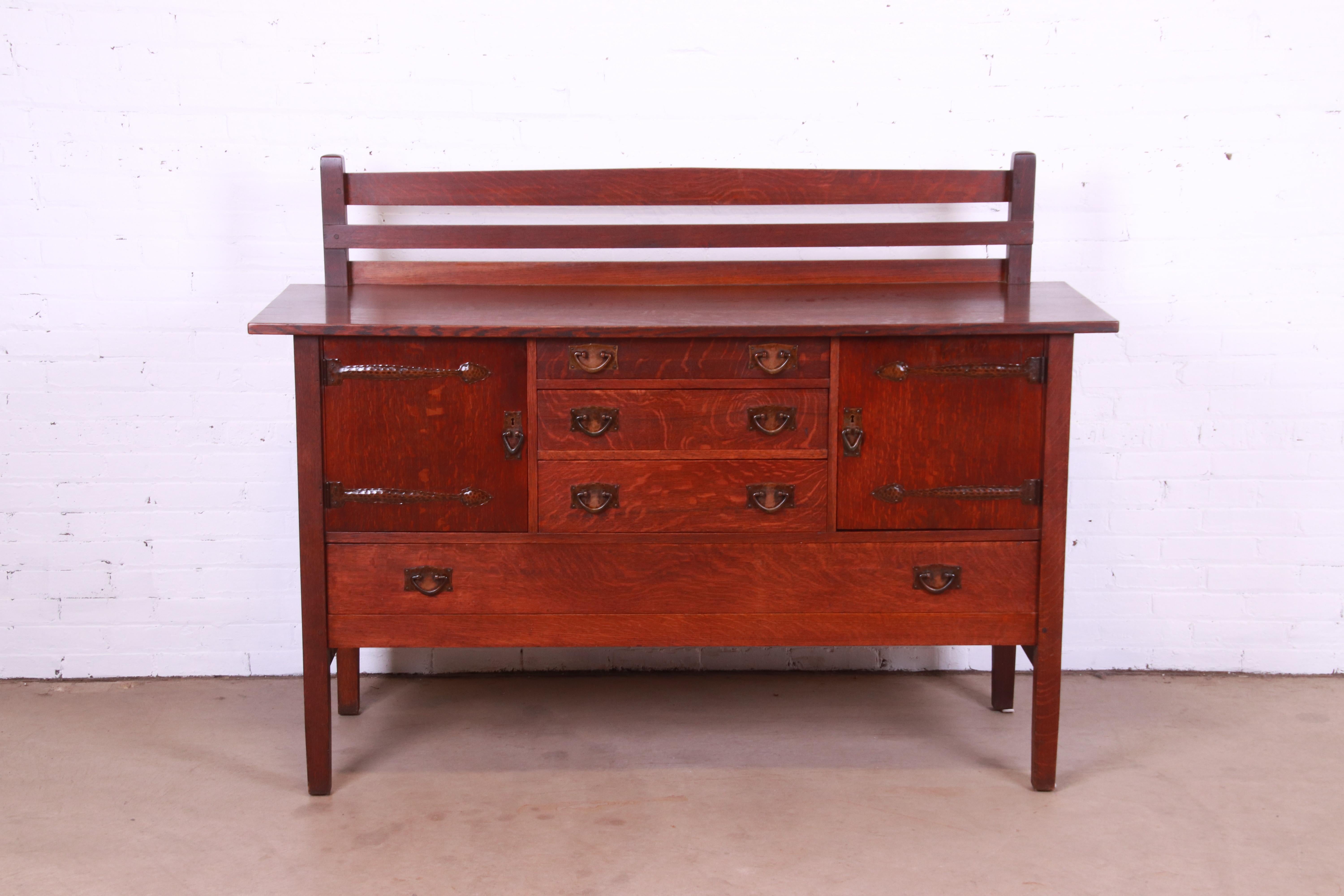 A rare and exceptional antique Mission oak Arts & Crafts sideboard or credenza with plate rack

By Gustav Stickley

USA, Circa 1900

Quarter sawn oak, with ooze leather lined top drawer, and original hammered copper hardware.

Measures: 66