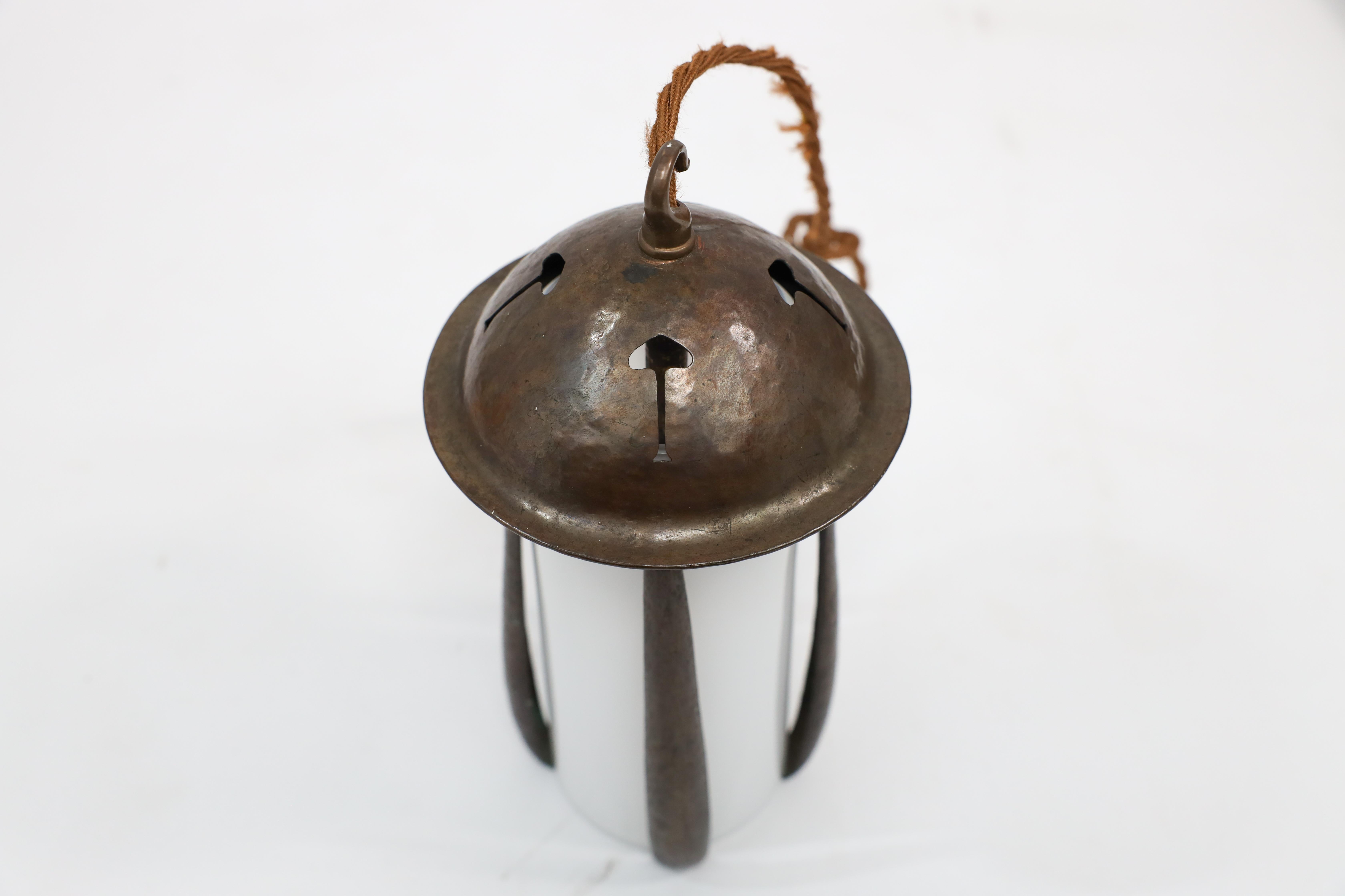 Arts and Crafts Gustav Stickley style. An Arts & Crafts hand hammered patinated copper lantern For Sale