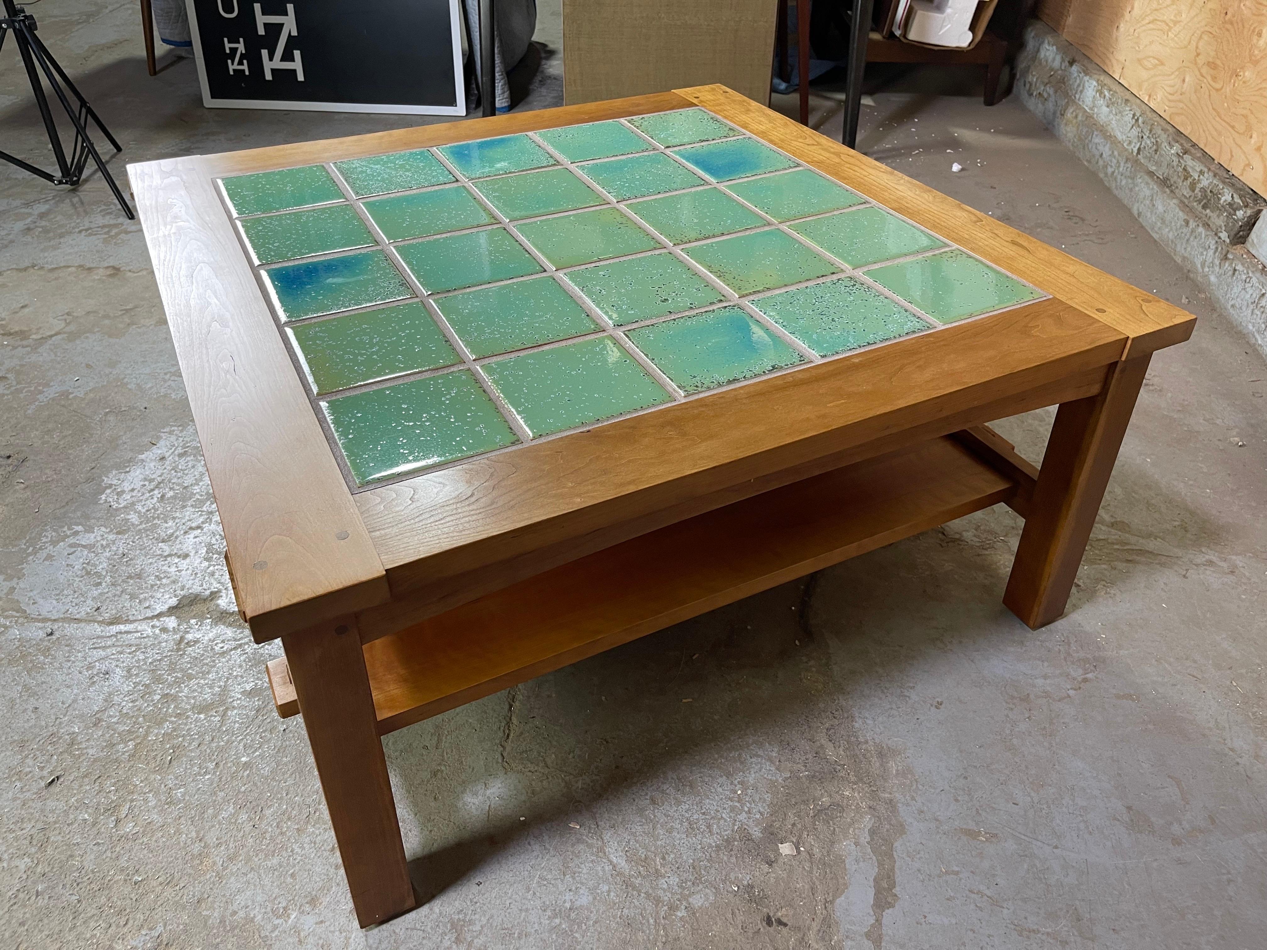 Great teal blue tiled top stickley coffee table. Heavy and sturdy. This thing can support some weight! Tiles are beautiful and as always excellent craftsmanship. Made in 2001. Some light wear - see pictures. 
38.5