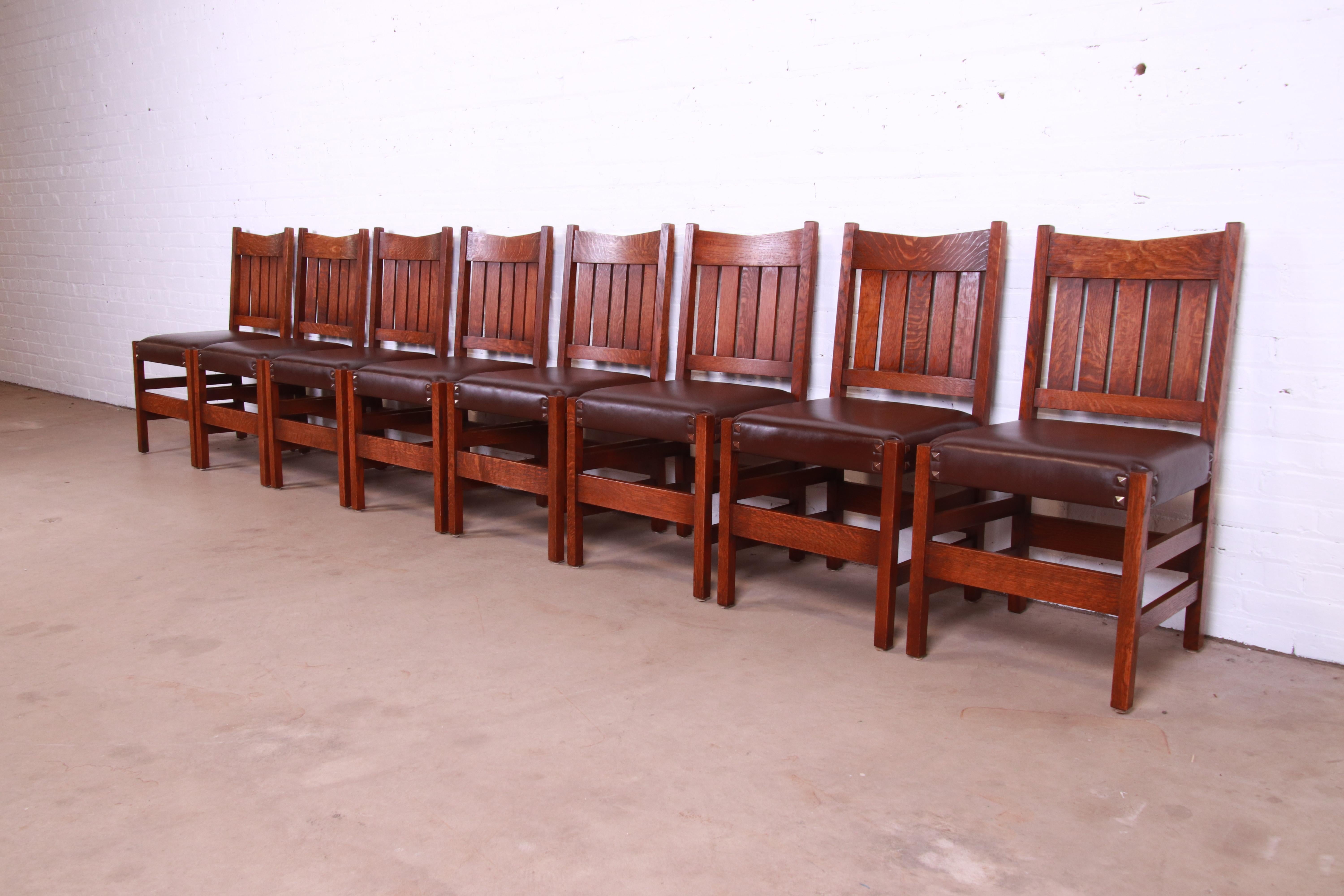 An exceptional set of eight Arts & Crafts v-back dining chairs

Designed by Gustav Stickley (circa 1900) and produced by Warren Hile Studio

USA, Circa 1980s

Solid quartersawn oak frames, with original leather upholstery.

Measures: 18.75
