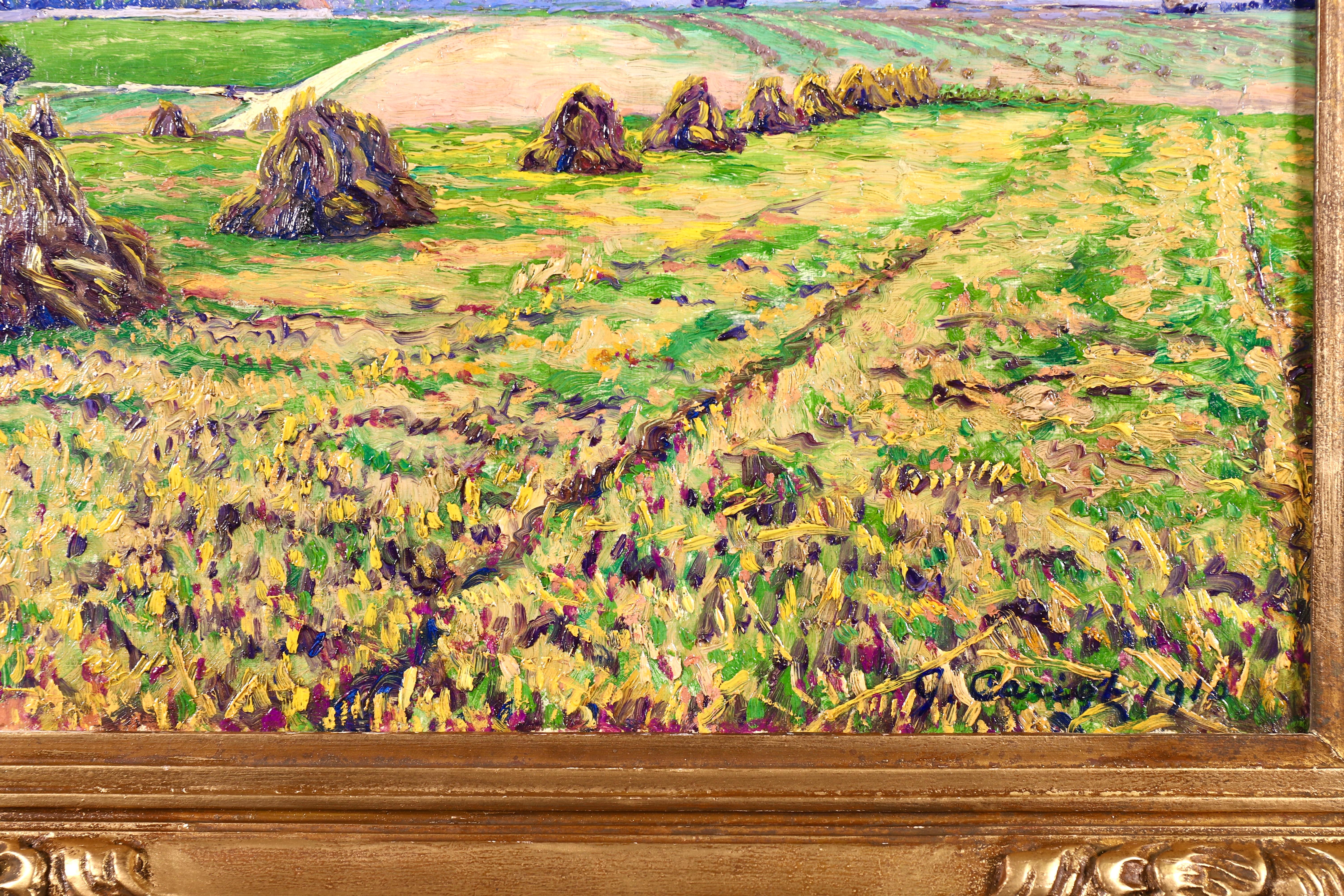 Ein wunderschönes Landschaftsgemälde in Öl auf Leinwand des postimpressionistischen Malers Gustave Camille Gaston Cariot:: das Haystacks auf den Feldern am Ende der Ernte darstellt. Signiert und datiert 1910 unten rechts. Dieses Gemälde ist derzeit