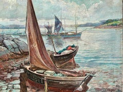 Early 20th century Harbor with fishing boats at dock with landscape