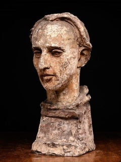 Tête sculptée et polychrome masculine modelée d
un atelier d
artiste.