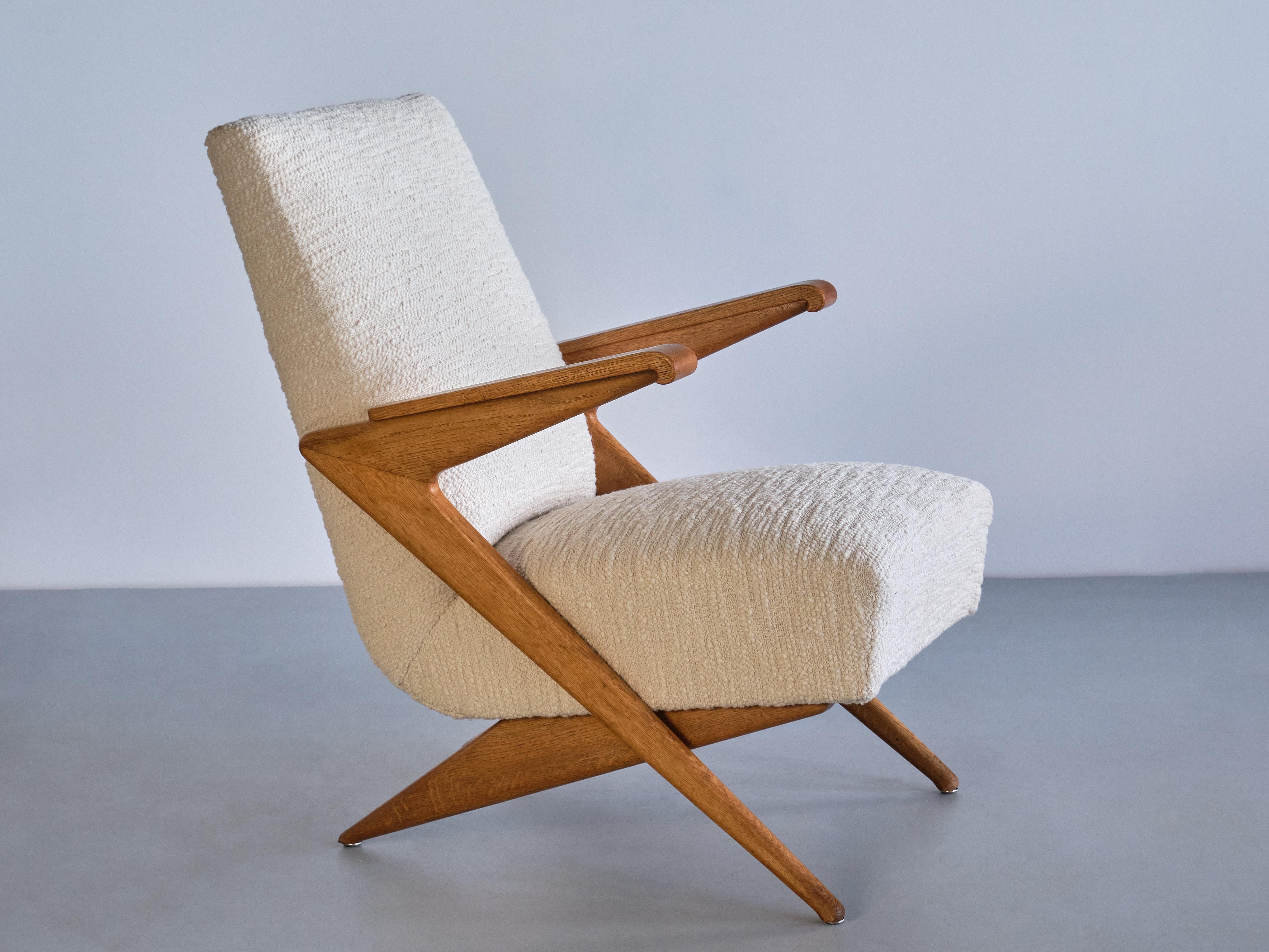 This rare armchair was produced in France in the late 1950s. The design of this particular model is attributed to the designer Gustave Gautier.

The chair is characterized by the sharp angles, geometric lines and scissor construction of the solid