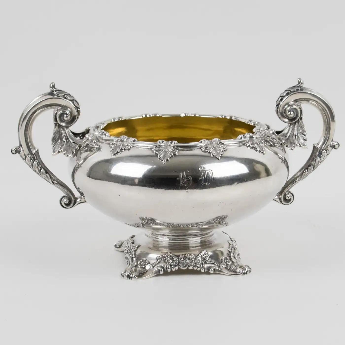 This is a turn of the 19th Century sterling silver decorative bowl designed and crafted by Odiot, Paris. The rounded shape resting on a floral pedestal has an 