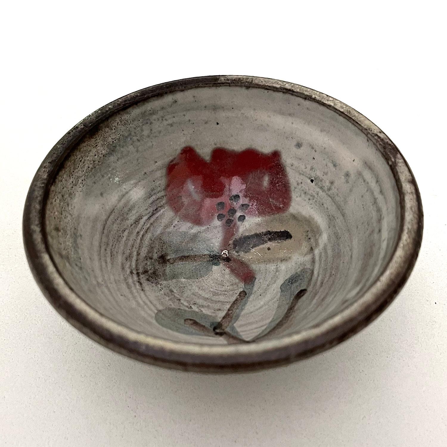 Gustave Reynaud earthenware vessel
Vallauris, France, circa 1960's
Organic composition and neutral palette 
Signature floral motif
This petite vessel beyond is precious
Perfect to use as a ring dish as it will brighten up any surface
Patina from age