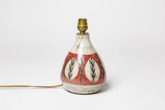 Lampada da tavolo in ceramica bianca e rossa Gustave Reynaud Lemurier design del XX secolo