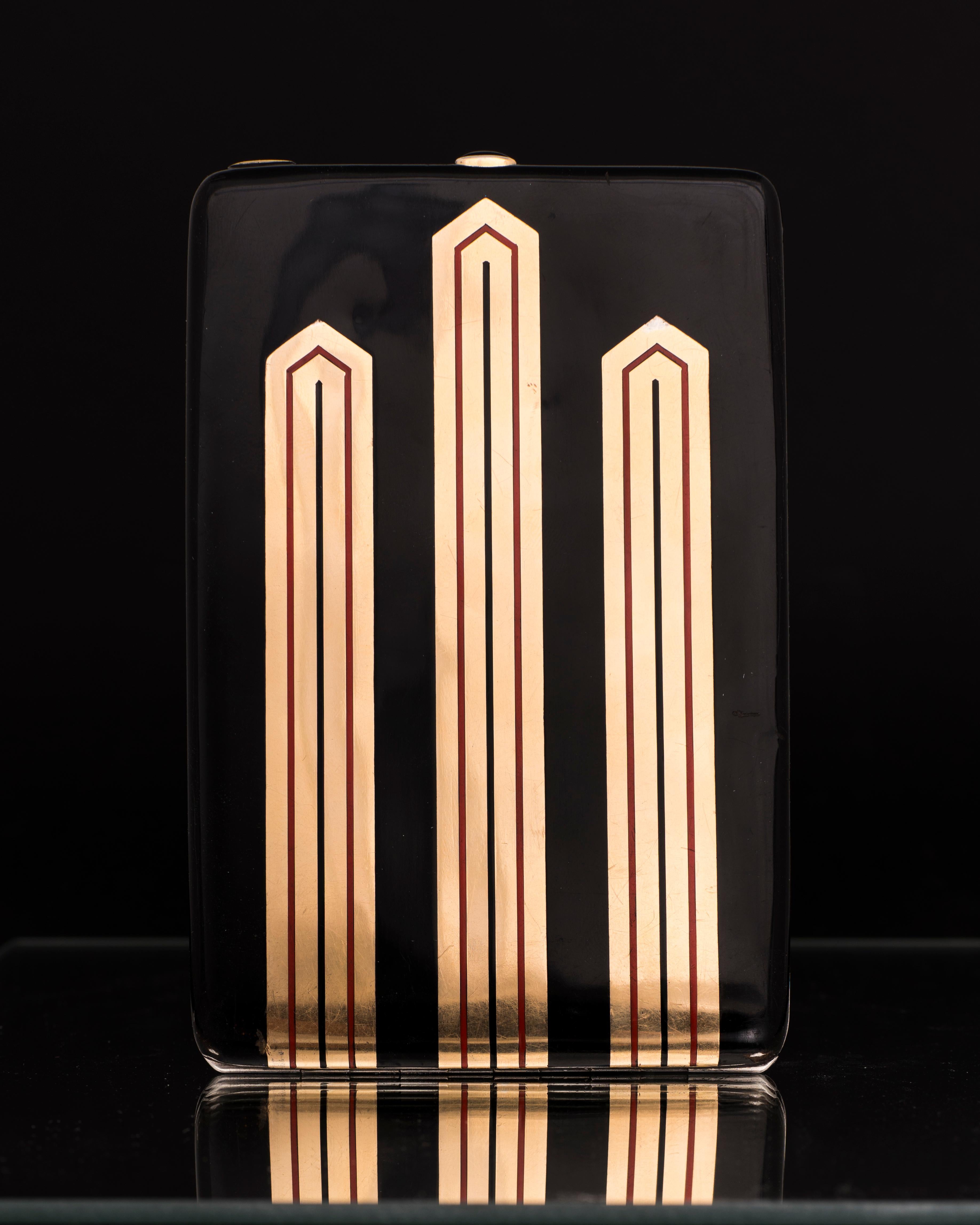Express Shipping still available during Lockdown

Gustave-Roger Sandoz
Cigarette Case, Circa 1925
Silver with Enamel geometric decoration on both sides. The clasp set with a cabochon of Onyx.
With maker's mark and French assay marks
Length : 5
