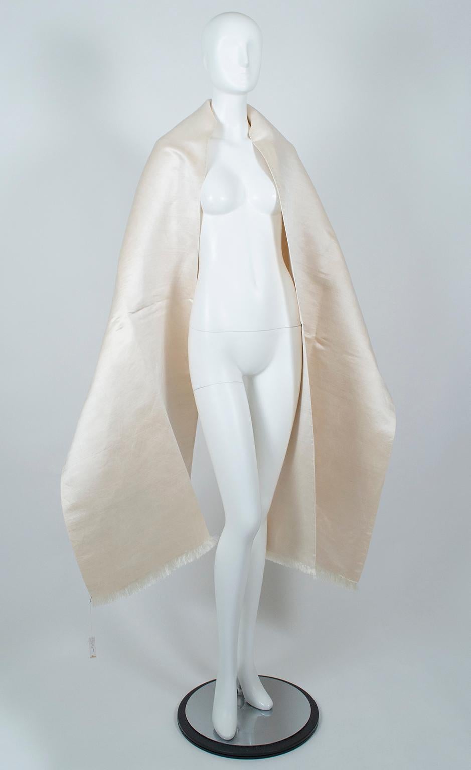 One of Jacqueline Kennedy Onassis’s favorite designers, Gustave Tassell was known for his ultra-simple, yet powerfully classic looks.  To wit: this piece is one of his scarves, but its massive size (9 feet!) and opulent fabric provide endless