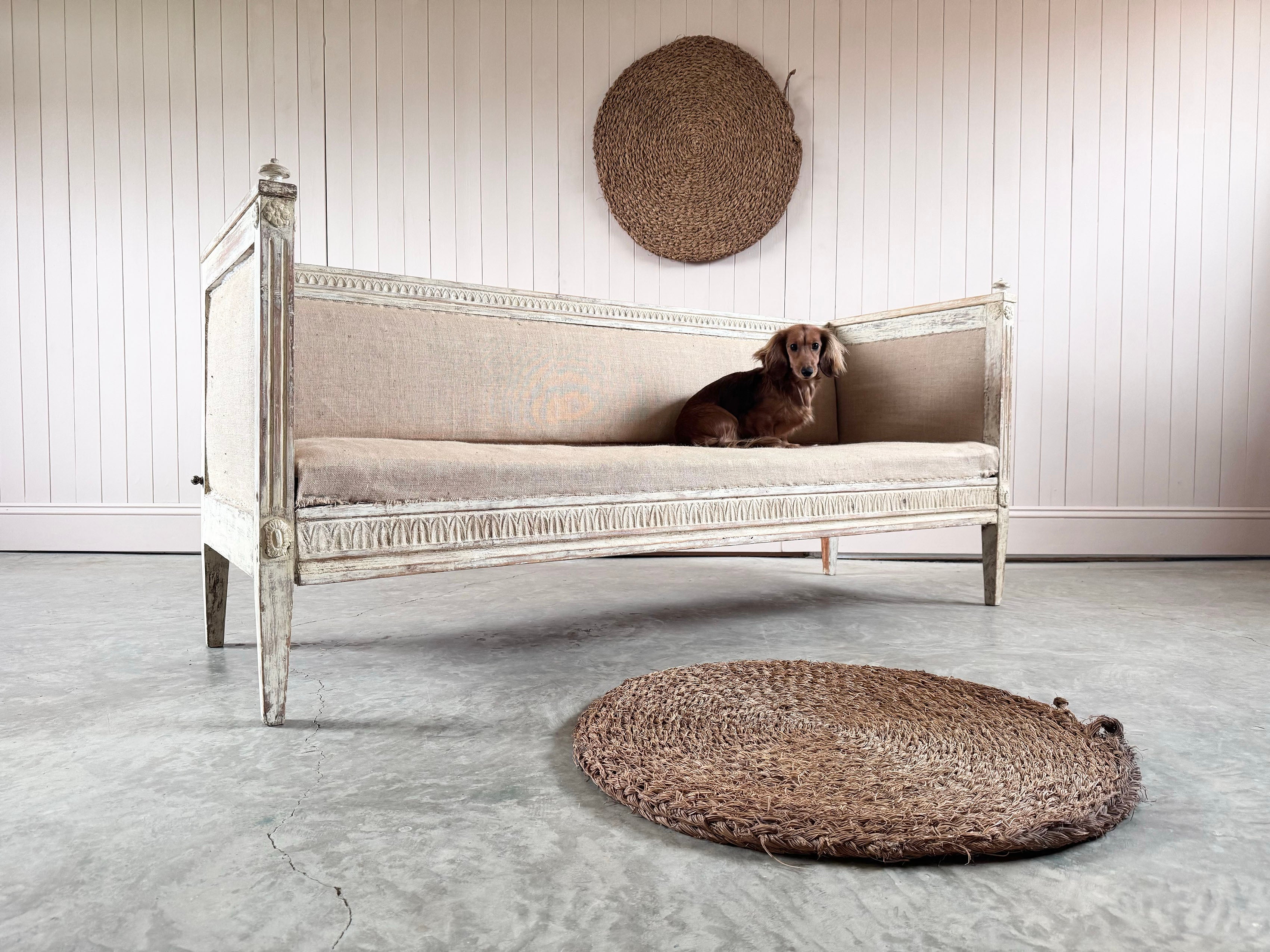 This beautiful antique Swedish bench is early 19th century from Northern Sweden.  

The layers of paint have been dry scraped revealing the original colours and beautiful carved details.

This was originally designed to be dismantled, as is often