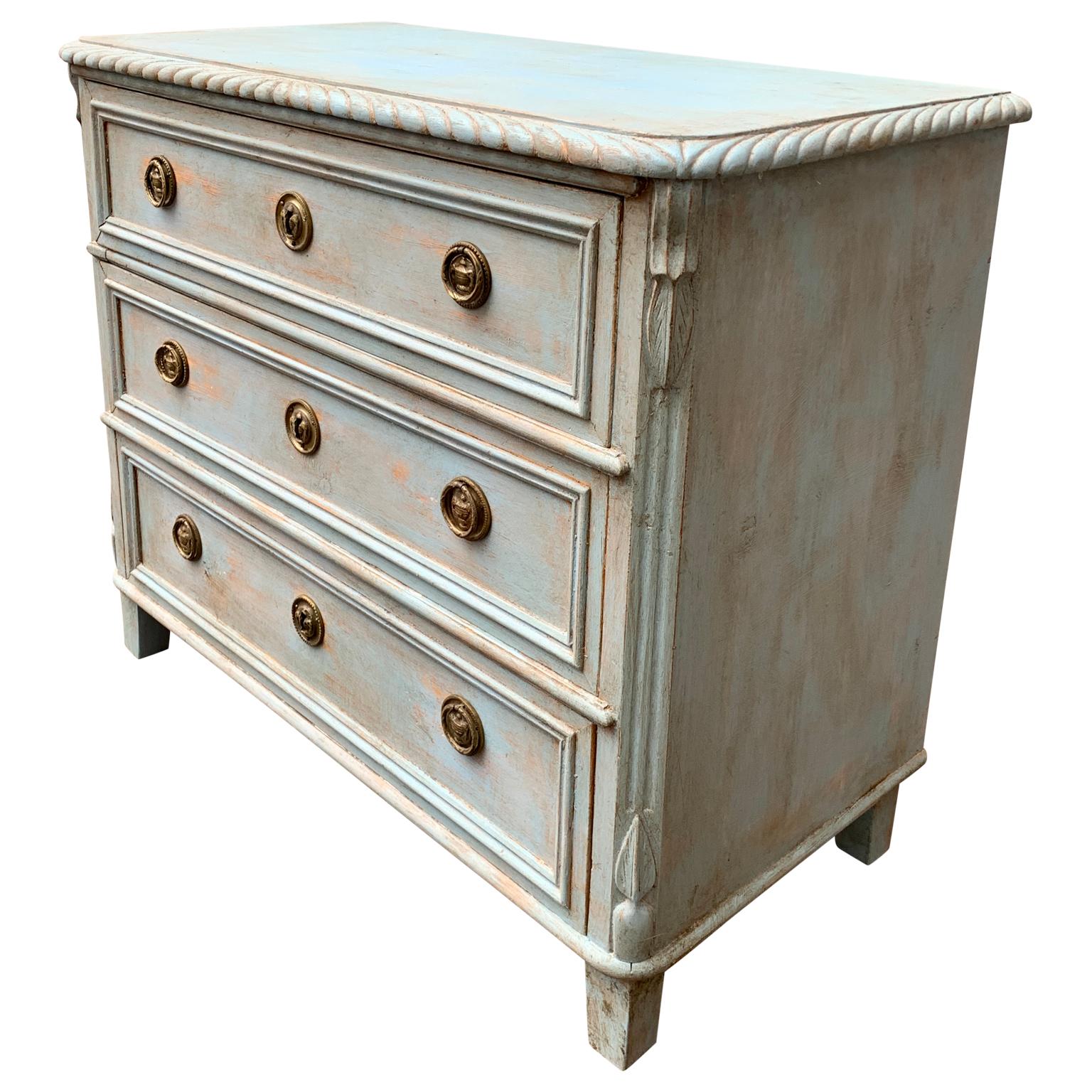 A small Gustavian-style light blue painted chest with 3 drawers and brass hardware from the second half of the 19th Century. This little Scandinavian chest could be used as a nightstand, it is clean, fresh pine scent and inside the drawers can be