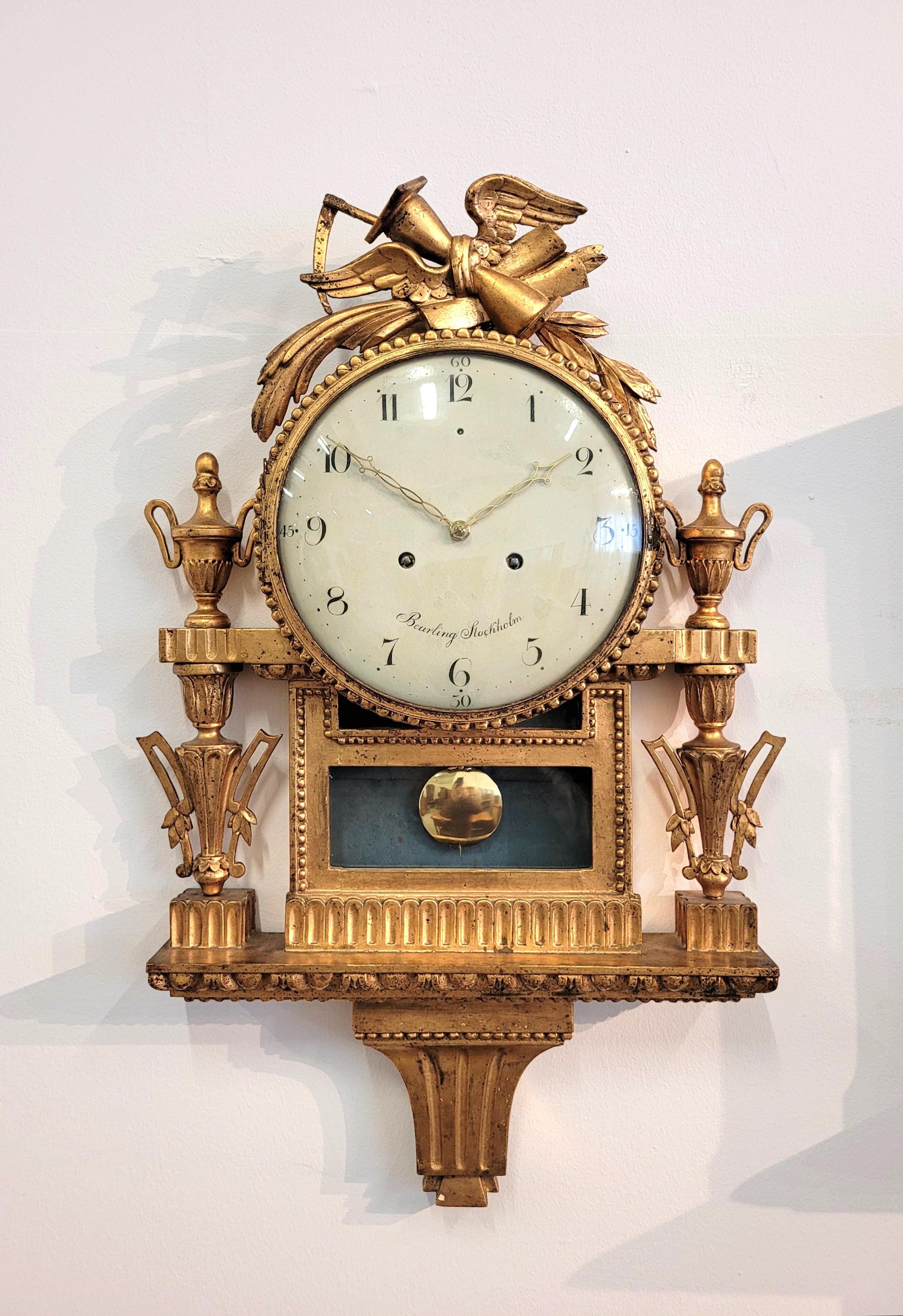 Antique Louis XVI cartel clock

swedish
wood gilded
around 1800

Dimensions: H x W x D: 79 x 50 x 12 cm

Description
Antique wall clock, so called Cartel clock, made of carved and gilded wood.
The clock is from the period of Swedish