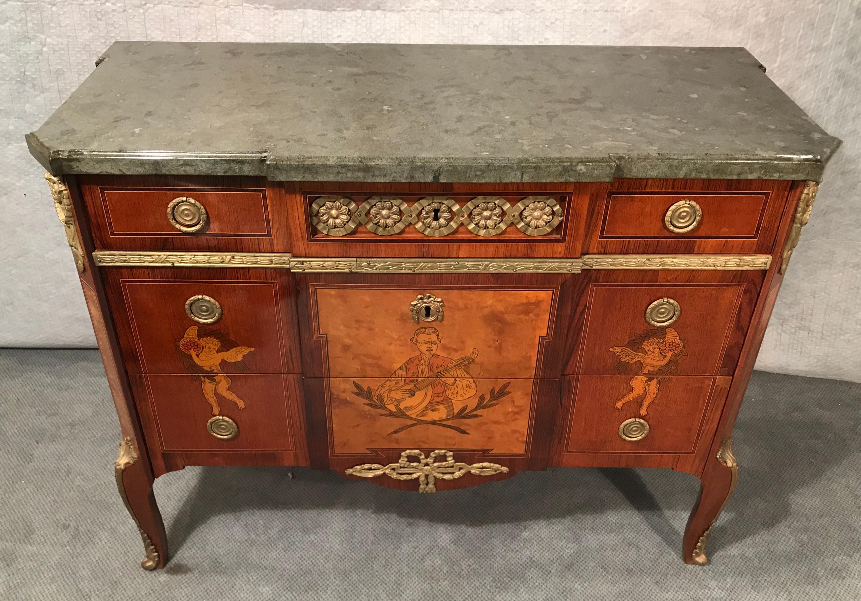 Gustavian commode, Sweden 19th century, Beautiful walnut, beechwood, elmwood and mahogany marquetry with hand drawn pictures on front and sides. Original brass fittings. Grey- greenish Kolmarden marble top. Beautiful commode in the style of the late