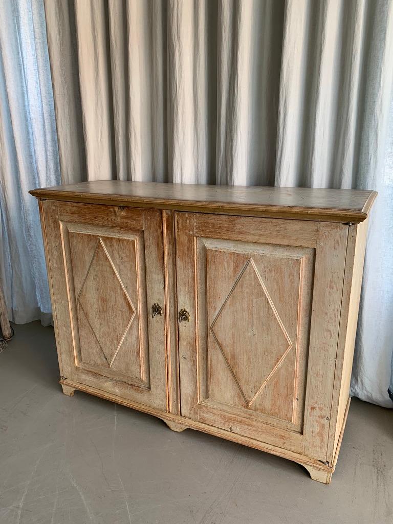 Antique original Swedish Gustavian cabinet or cupboard with two doors and shelves. This beautiful sideboard has been scraped back to the original grey beige color from the late 1700s and the top has a wonderful 